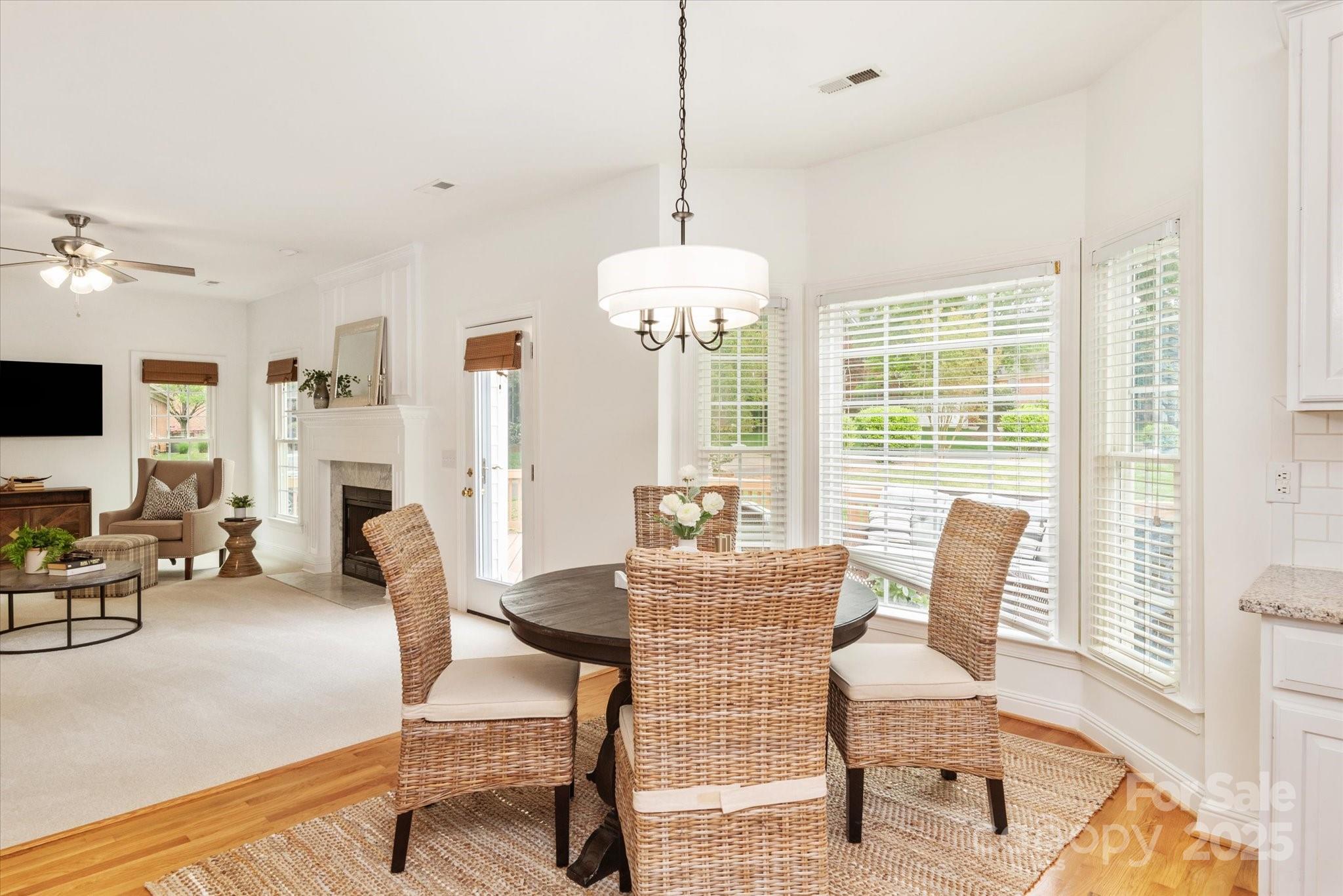 1006 Baldwin Lane Waxhaw, NC 28173 - Photo 14 of 42 a living room with furniture a fireplace and a flat screen tv