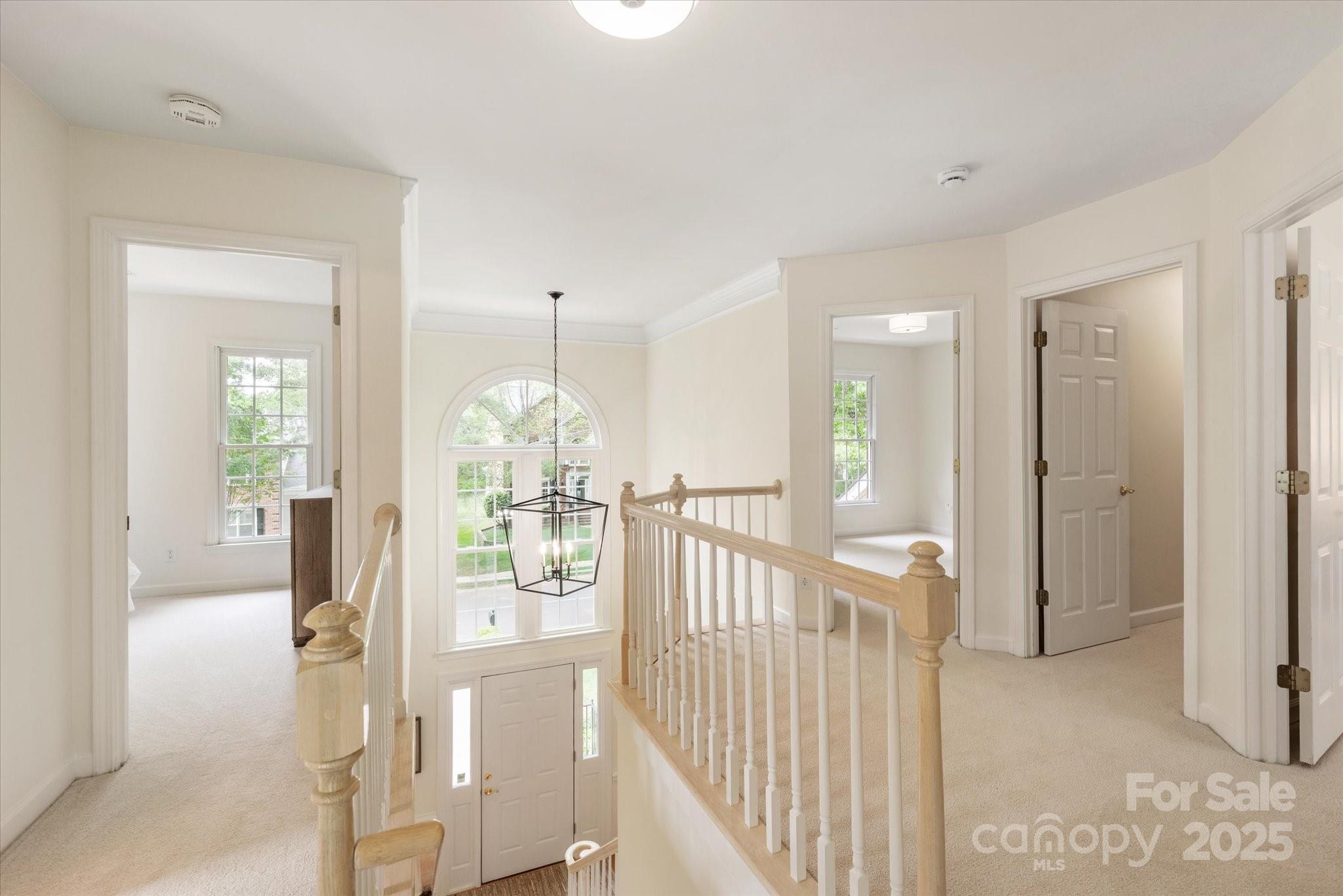 1006 Baldwin Lane Waxhaw, NC 28173 - Photo 22 of 42 a view of a hallway view with wooden floor and windows