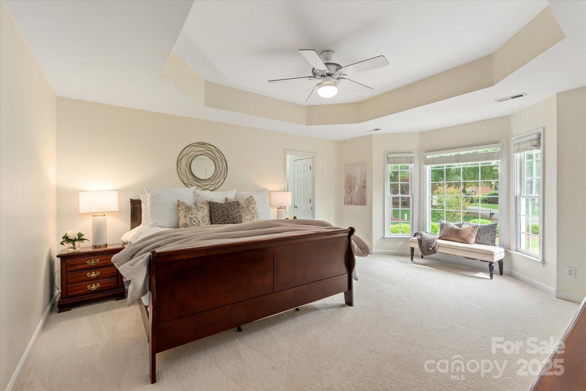 1006 Baldwin Lane Waxhaw, NC 28173 - Photo 24 of 42 a bed room with a bed and a chandelier