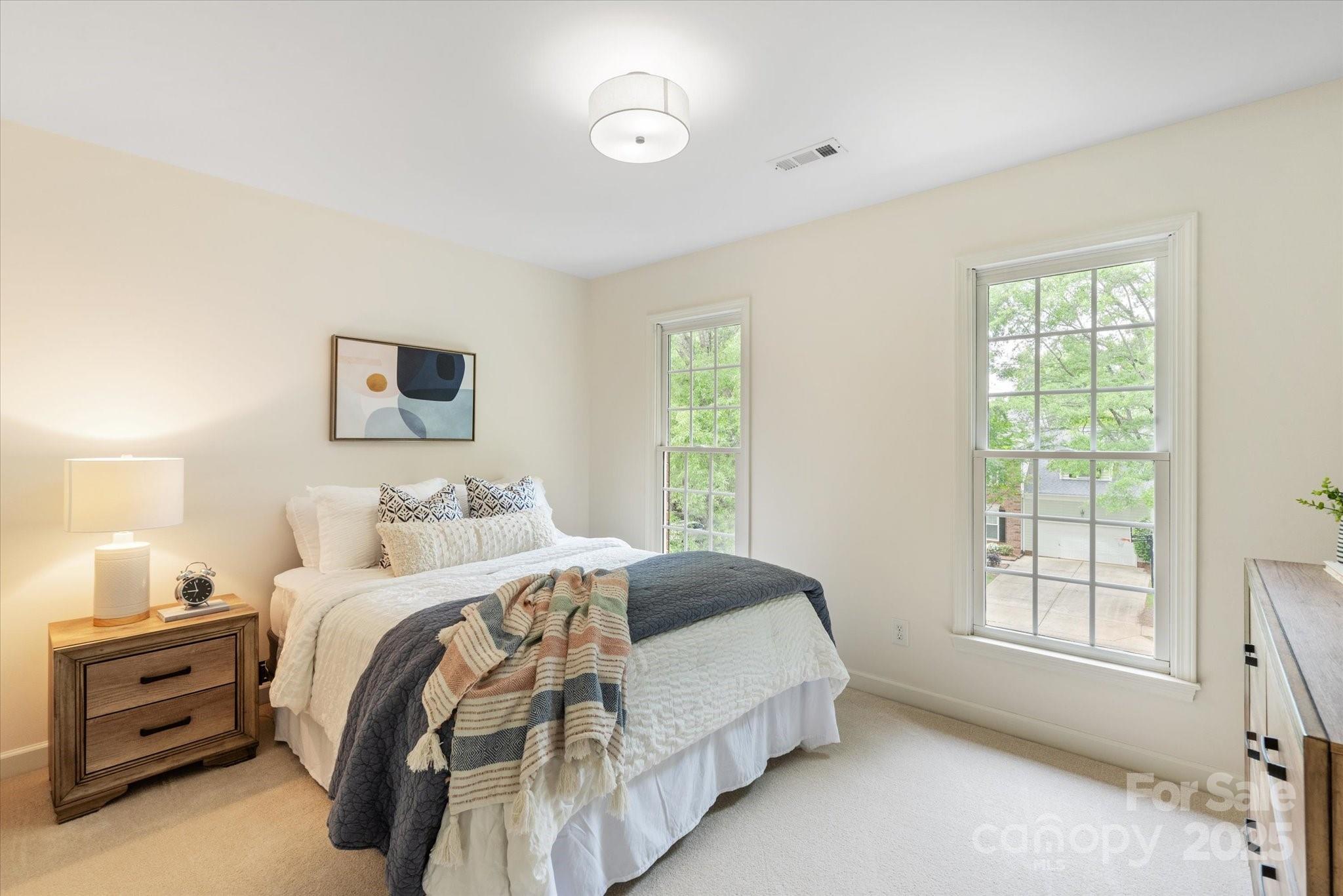 1006 Baldwin Lane Waxhaw, NC 28173 - Photo 29 of 42 a bedroom with a bed and a window
