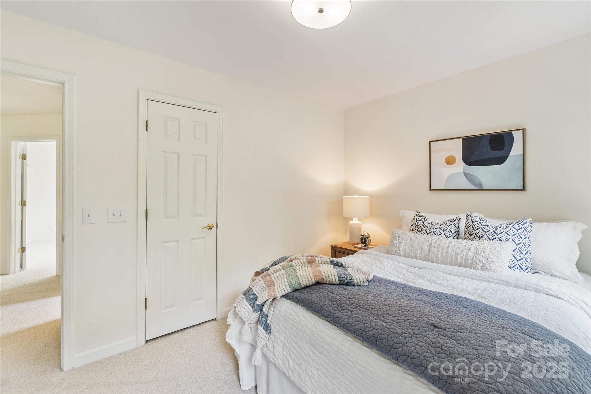 1006 Baldwin Lane Waxhaw, NC 28173 - Photo 30 of 42 a bedroom with a bed and a painting