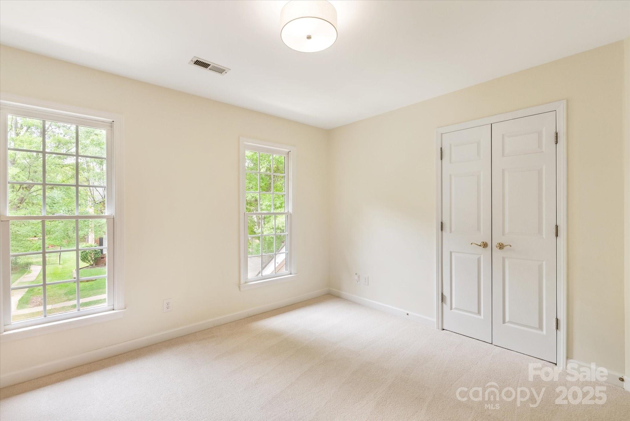 1006 Baldwin Lane Waxhaw, NC 28173 - Photo 34 of 42 an empty room with windows and closet