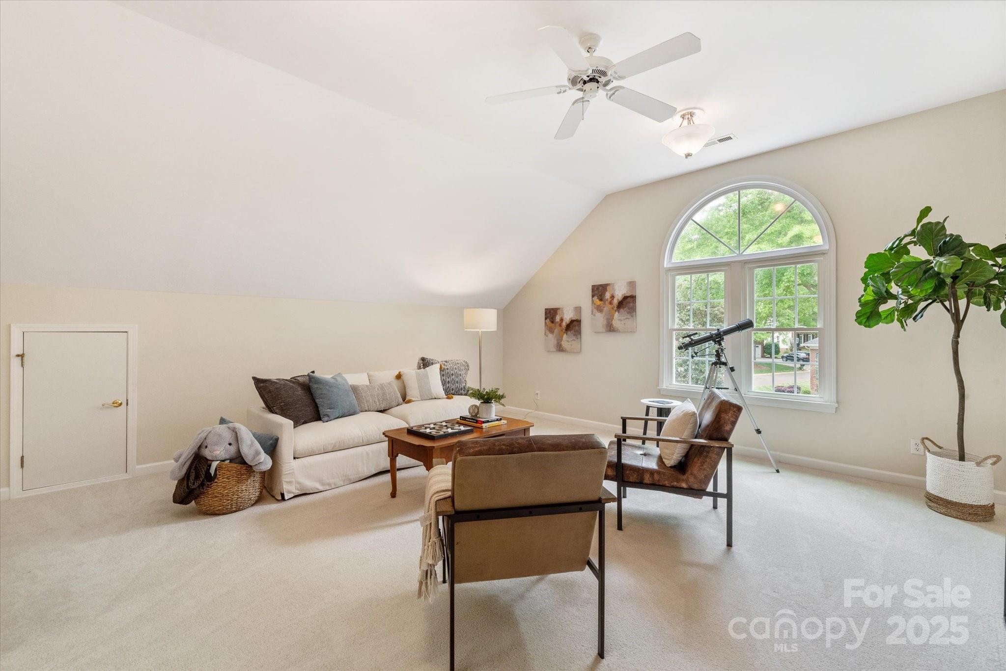 1006 Baldwin Lane Waxhaw, NC 28173 - Photo 36 of 42 a living room with furniture and a large window