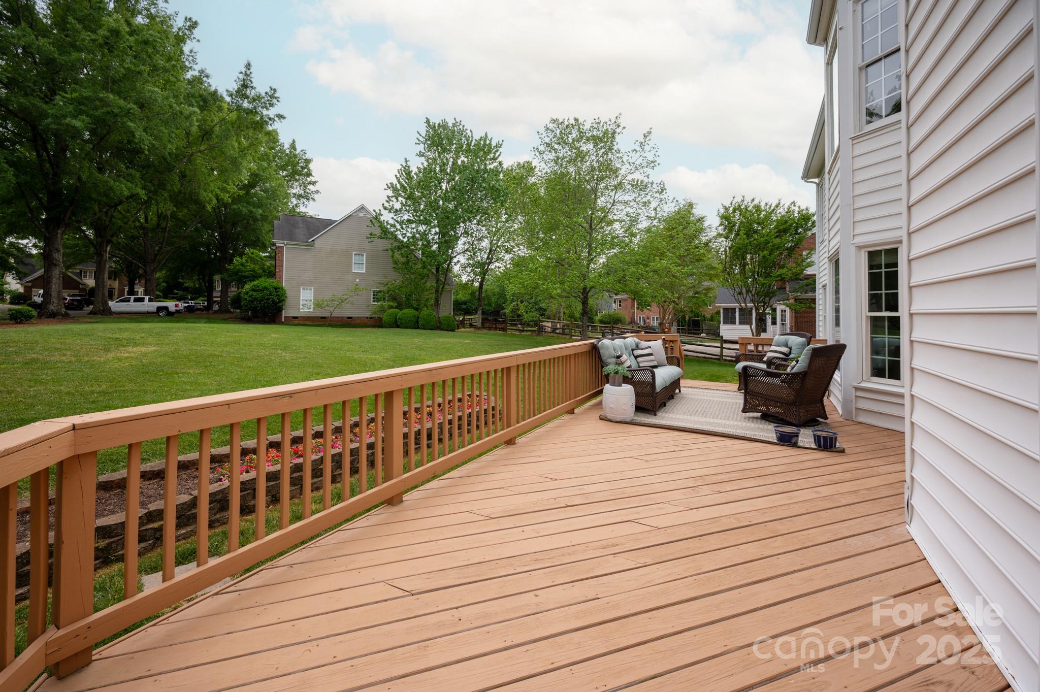 1006 Baldwin Lane Waxhaw, NC 28173 - Photo 37 of 42 a view of a deck with chairs and wooden fence