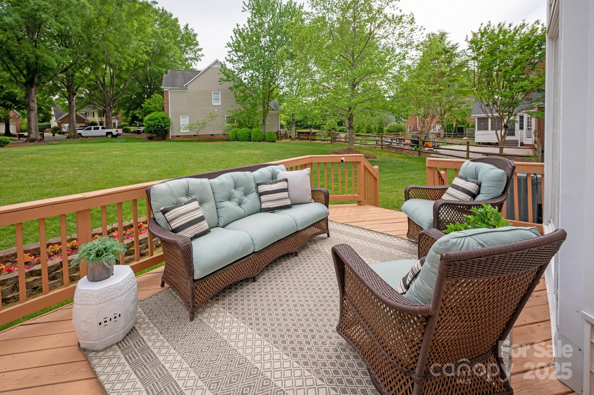 1006 Baldwin Lane Waxhaw, NC 28173 - Photo 38 of 42 a view of a patio with couches chairs and a fire pit