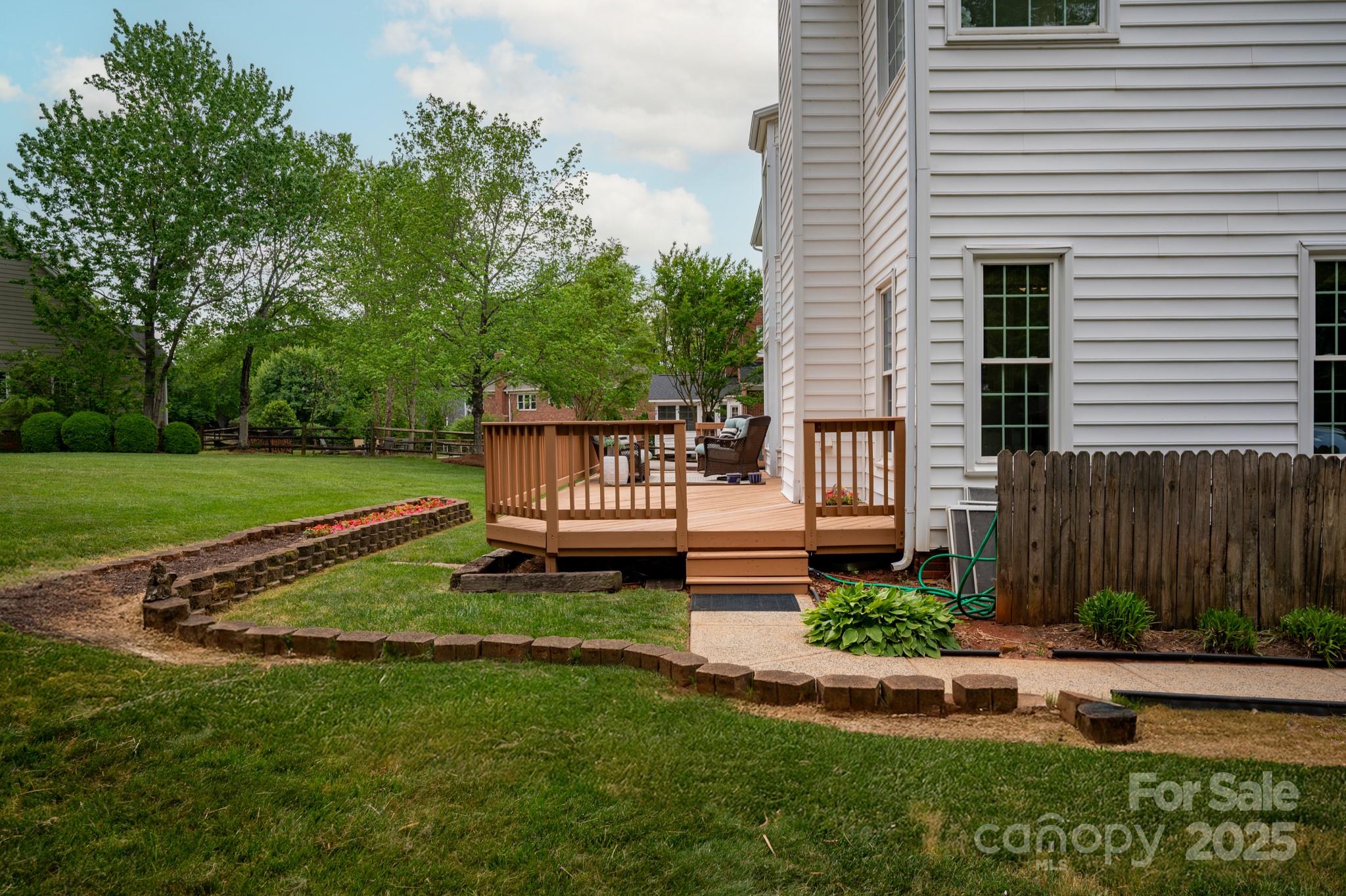 1006 Baldwin Lane Waxhaw, NC 28173 - Photo 39 of 42 a view of a chair and table in backyard of the house