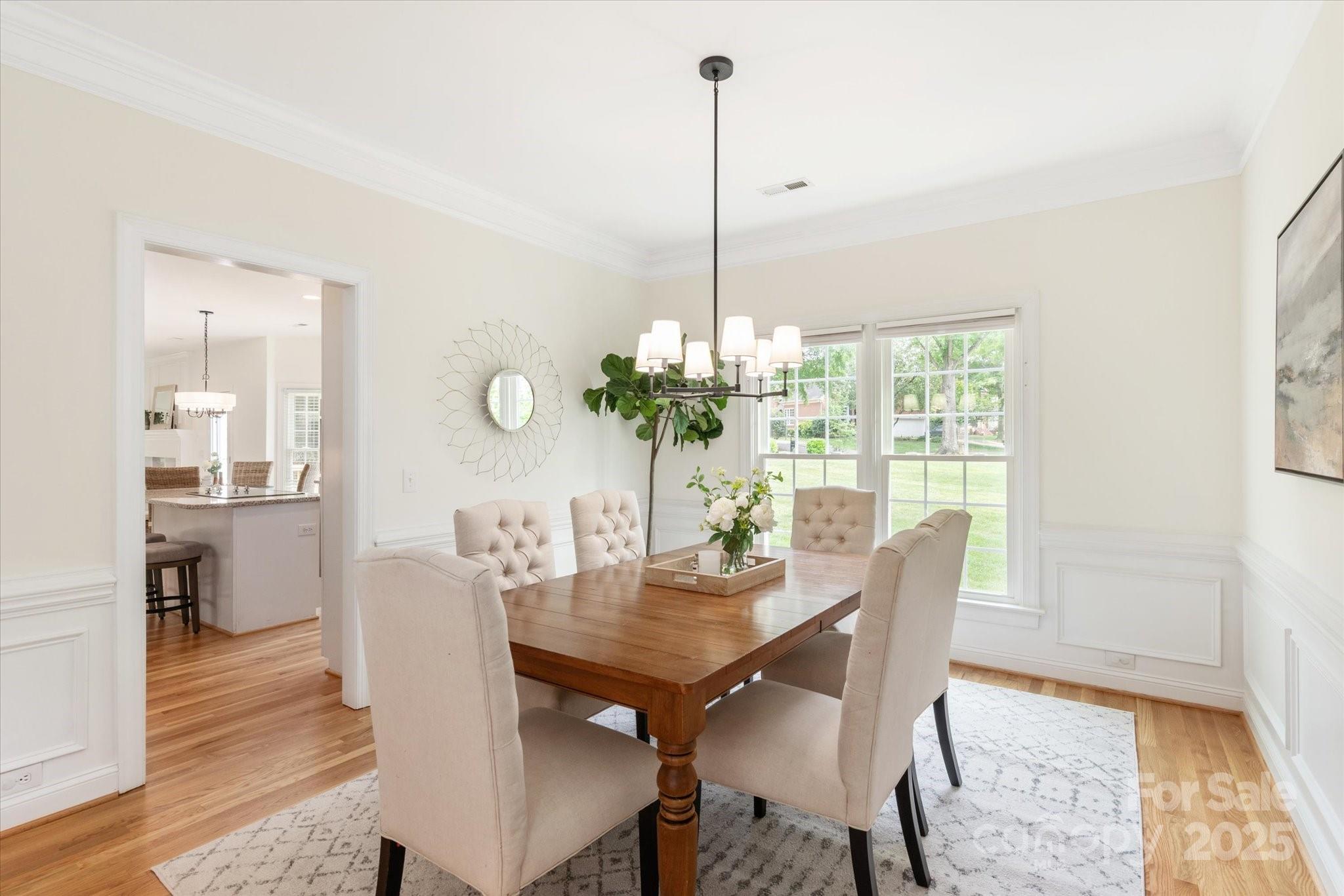 1006 Baldwin Lane Waxhaw, NC 28173 - Photo 7 of 42 a view of a dining room with furniture window and wooden floor