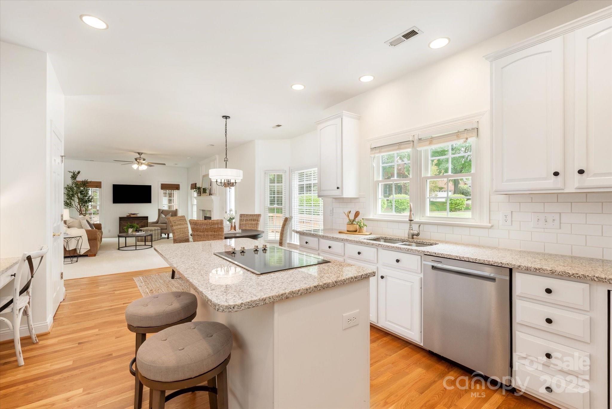 1006 Baldwin Lane Waxhaw, NC 28173 - Photo 9 of 42 a large white kitchen with a large window