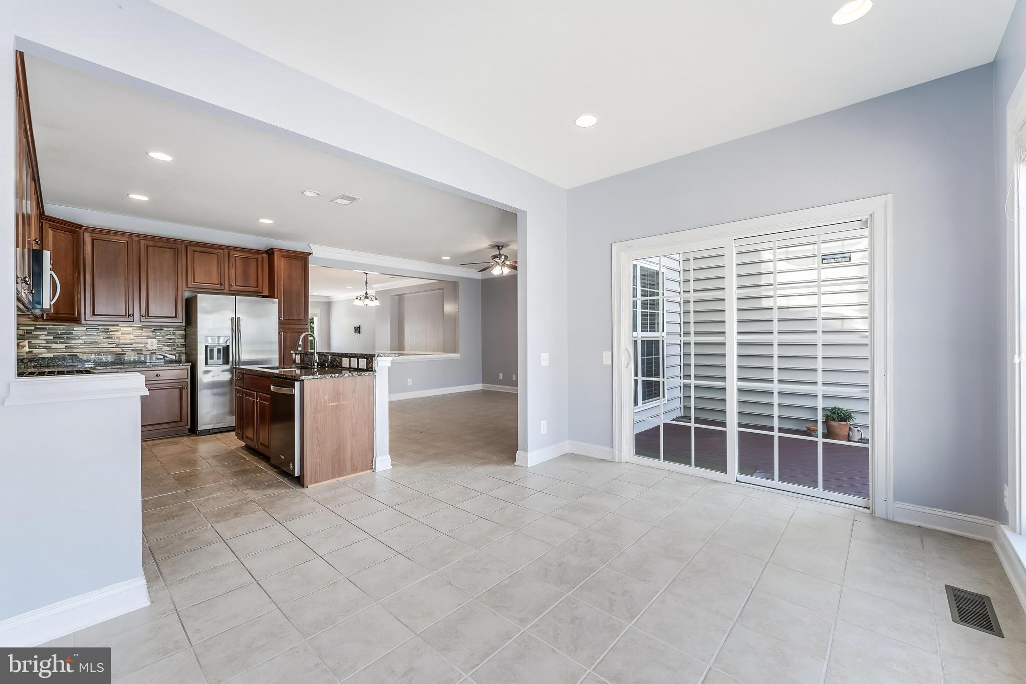 43583 White Cap Terrace Chantilly, VA 20152 - Photo 13 of 55 a open kitchen with cabinets and a large window