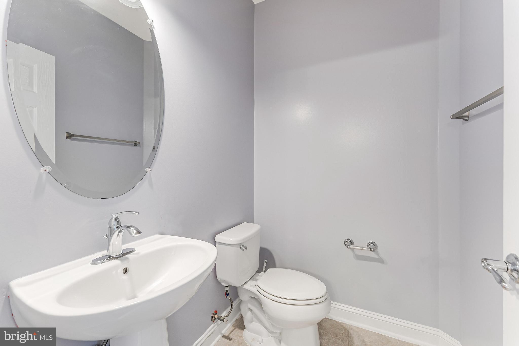 43583 White Cap Terrace Chantilly, VA 20152 - Photo 25 of 55 a bathroom with a sink and a toilet