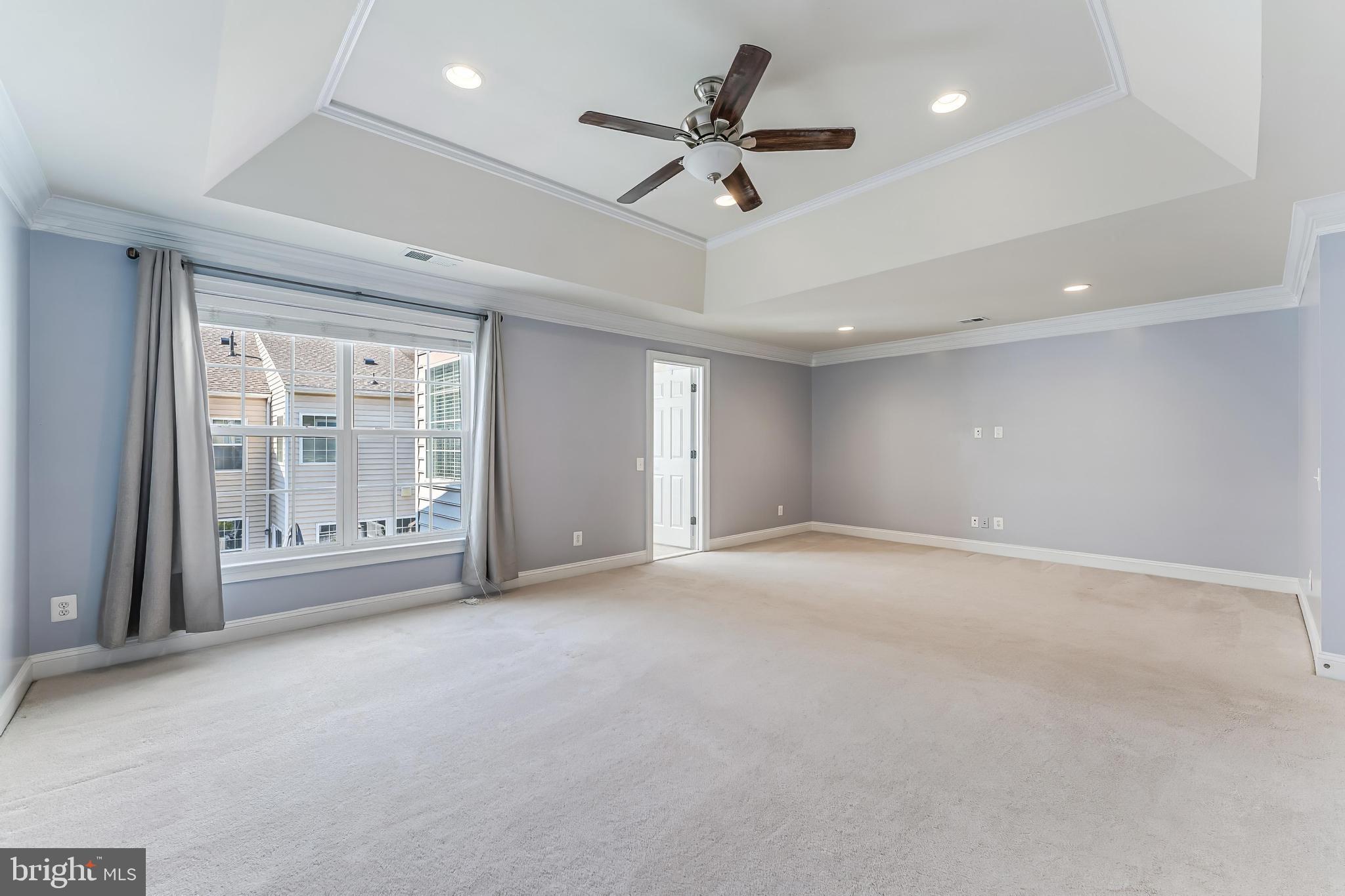 43583 White Cap Terrace Chantilly, VA 20152 - Photo 29 of 55 a view of an empty room with a ceiling fan and window