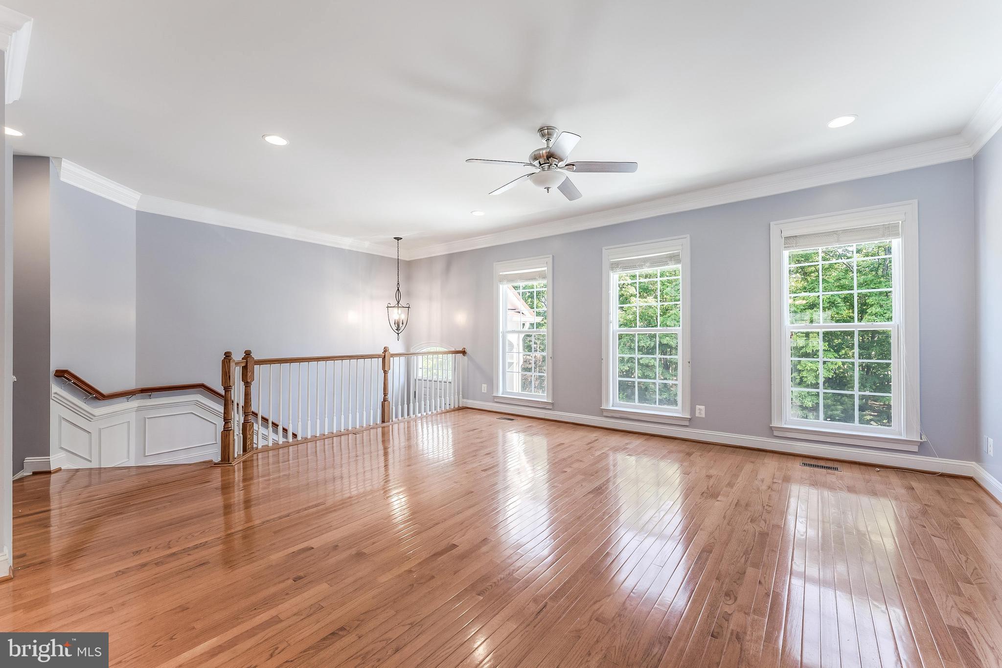43583 White Cap Terrace Chantilly, VA 20152 - Photo 3 of 55 a view of an empty room with wooden floor and a window
