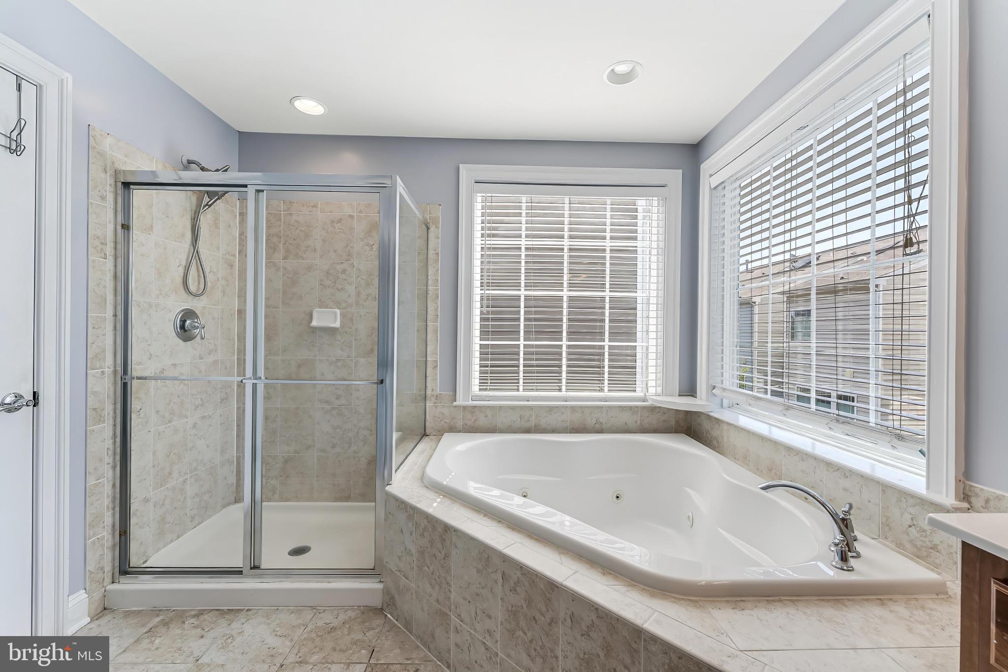 43583 White Cap Terrace Chantilly, VA 20152 - Photo 35 of 55 a bathroom with a bathtub and shower