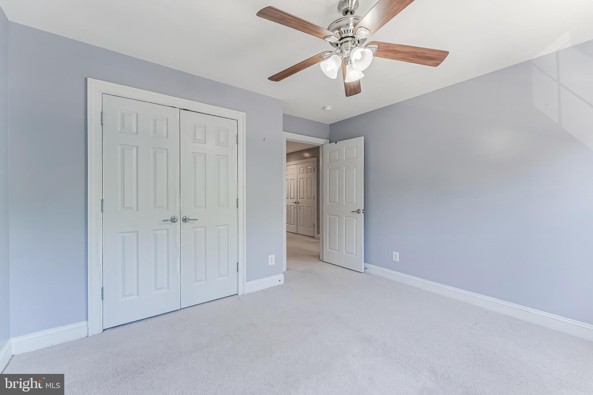 43583 White Cap Terrace Chantilly, VA 20152 - Photo 42 of 55 an empty room with a ceiling fan and a fan