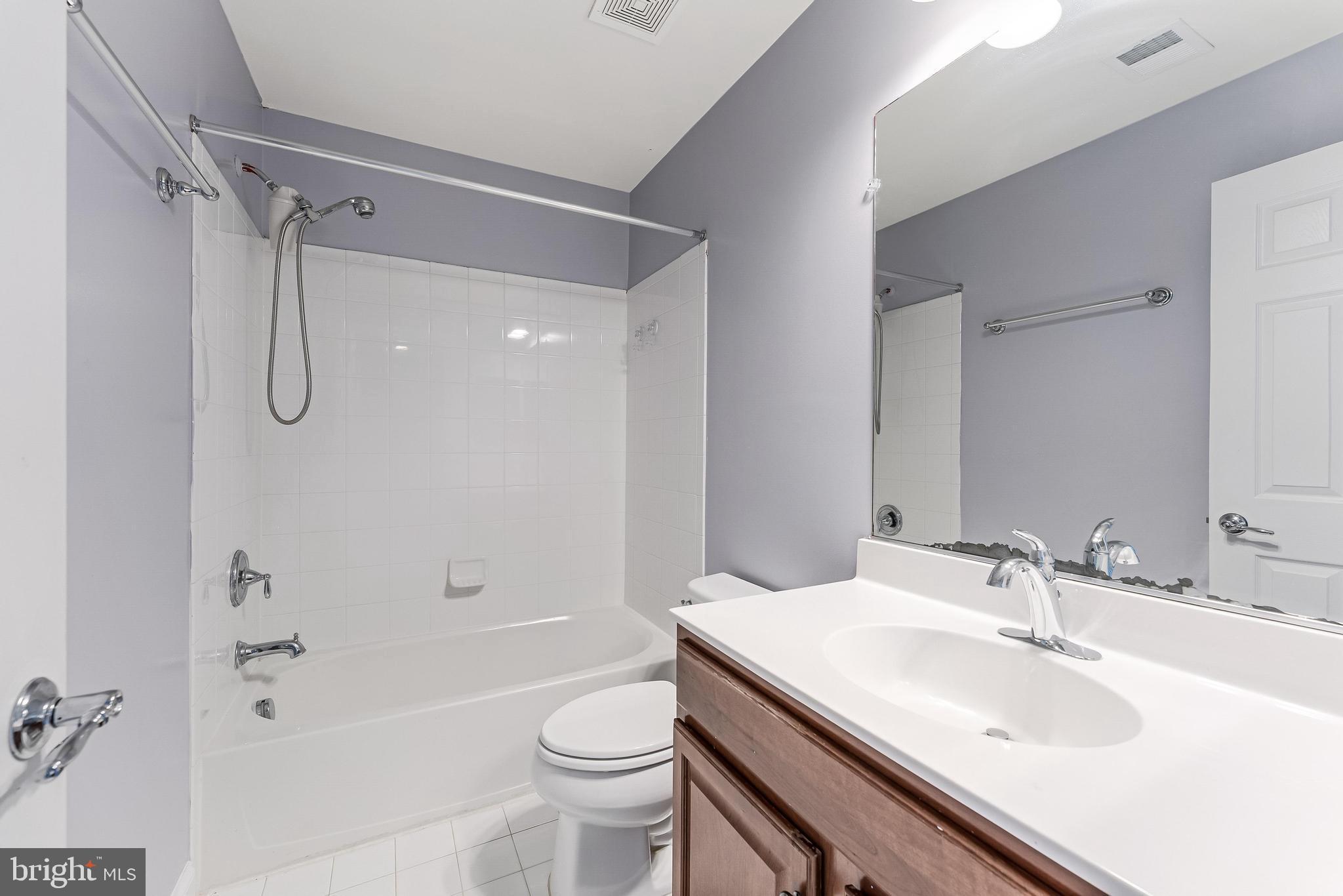 43583 White Cap Terrace Chantilly, VA 20152 - Photo 43 of 55 a bathroom with a sink a toilet and shower