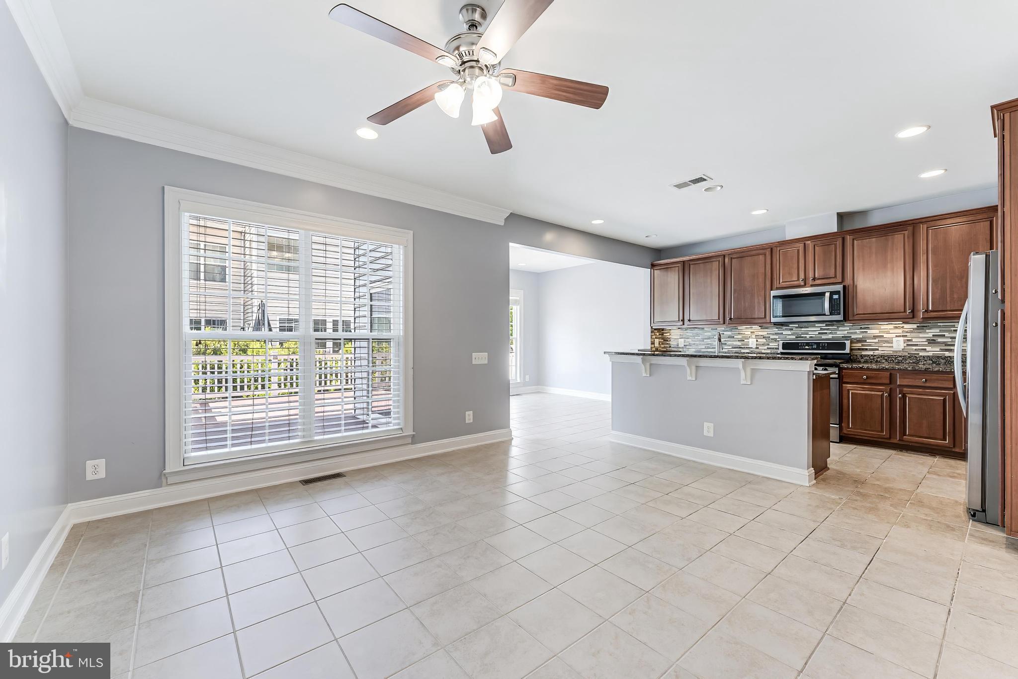 43583 White Cap Terrace Chantilly, VA 20152 - Photo 8 of 55 a large kitchen with cabinets and stainless steel appliances