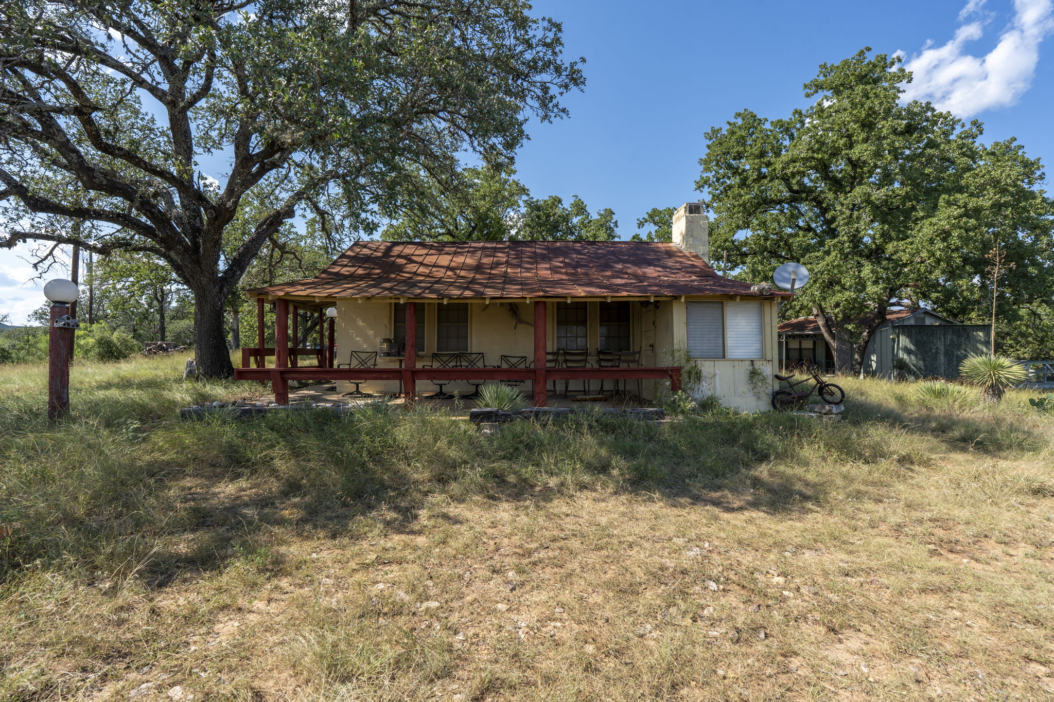 Tbd Singleton Road Marble Falls, TX 78654 - Photo 21 of 40 Old one room cabin built in the 1930's. Still usable featuring a chimney and covered porch. 1 of 2 cabins on the property.