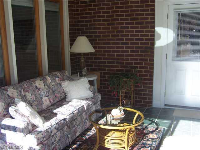 4909 Gold Crest Drive Oak Ridge, NC 27310 - Photo 11 of 16 Sunroom.