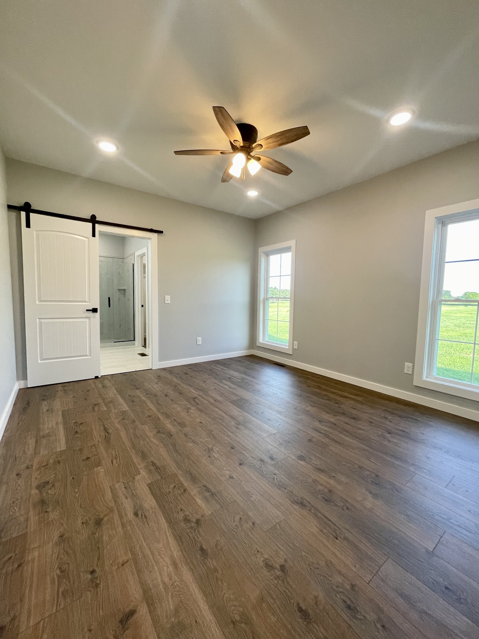 1456 Fall River Road Lawrenceburg, TN 38464 - Photo 13 of 30 a view of an empty room with window and wooden floor