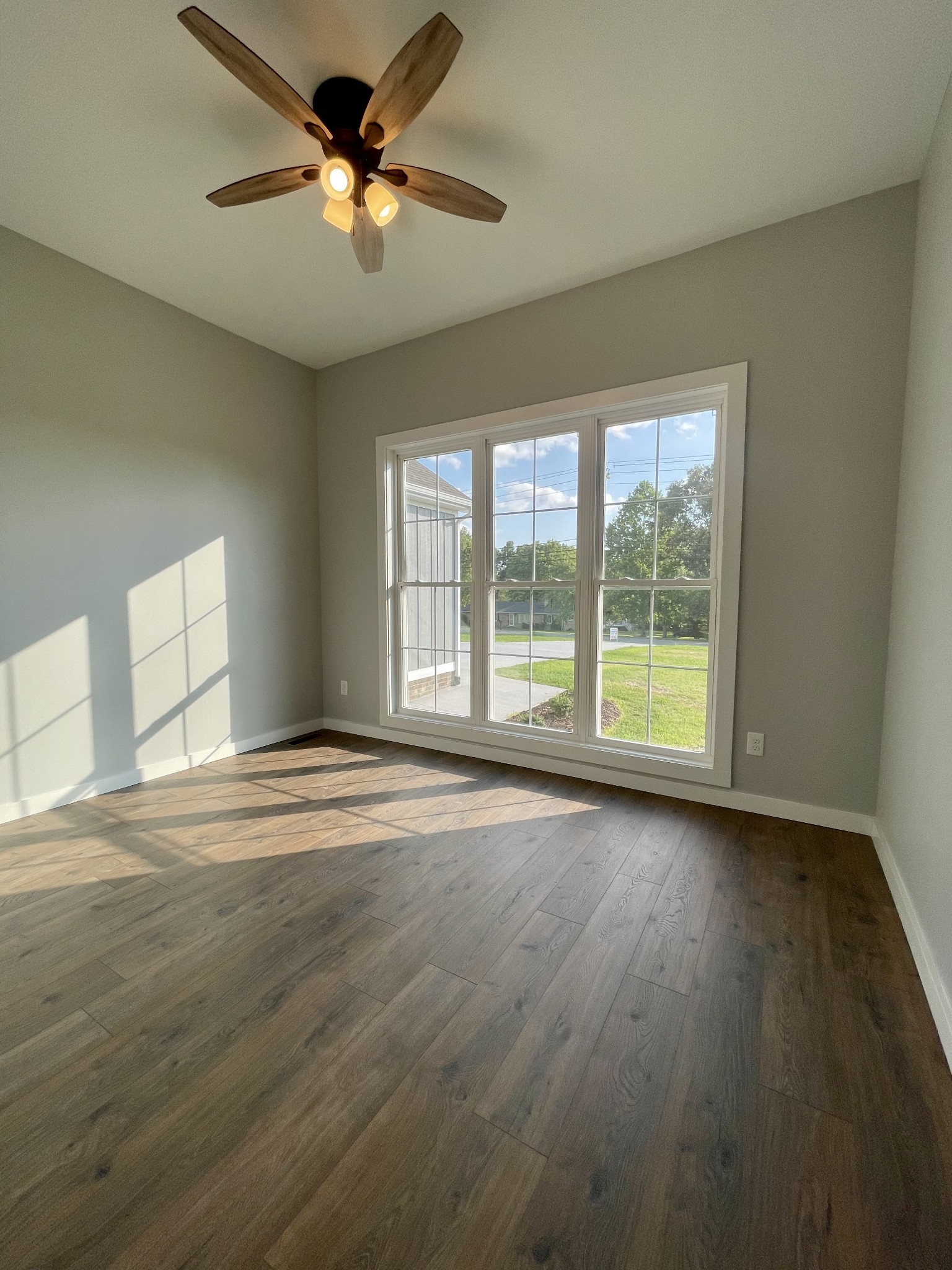 1456 Fall River Road Lawrenceburg, TN 38464 - Photo 24 of 30 a view of an empty room with a window and wooden floor