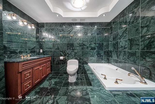 a bathroom with a toilet a sink and shower