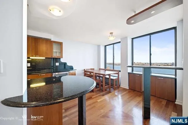 a balcony with furniture and city view