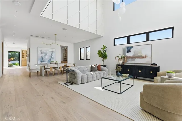 a view of a livingroom with furniture and a chandelier