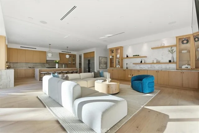 a kitchen with stainless steel appliances granite countertop a sink a stove and cabinets