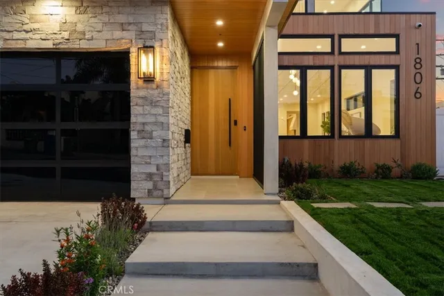 a view of a brick house with a yard