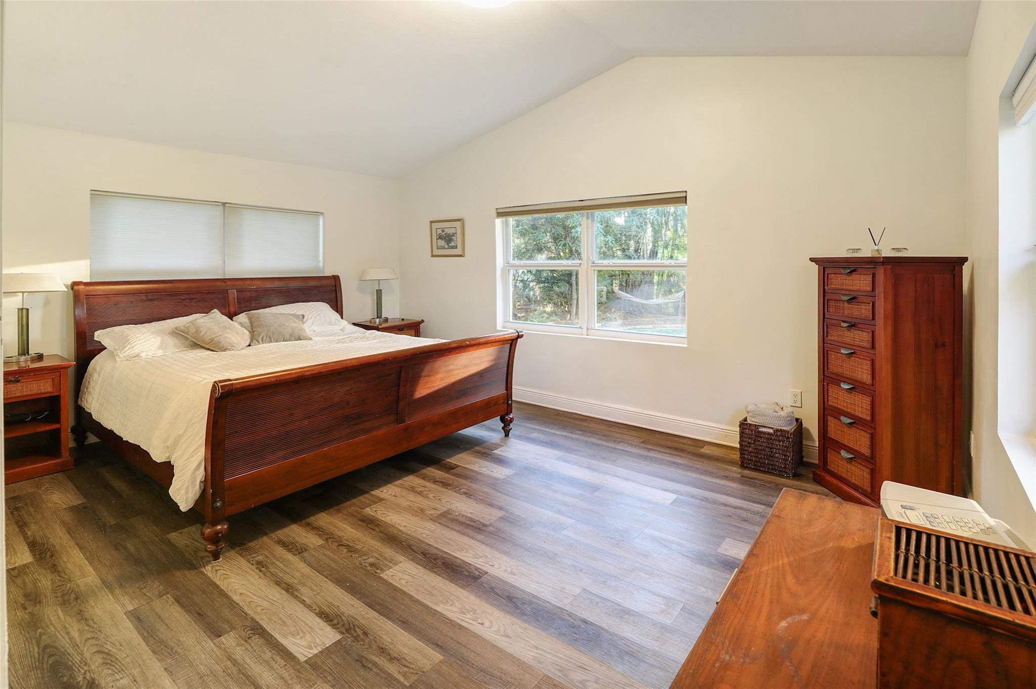 11410 Griffing Boulevard Miami, FL 33161 - Photo 15 of 42 a bedroom with a bed and wooden floor