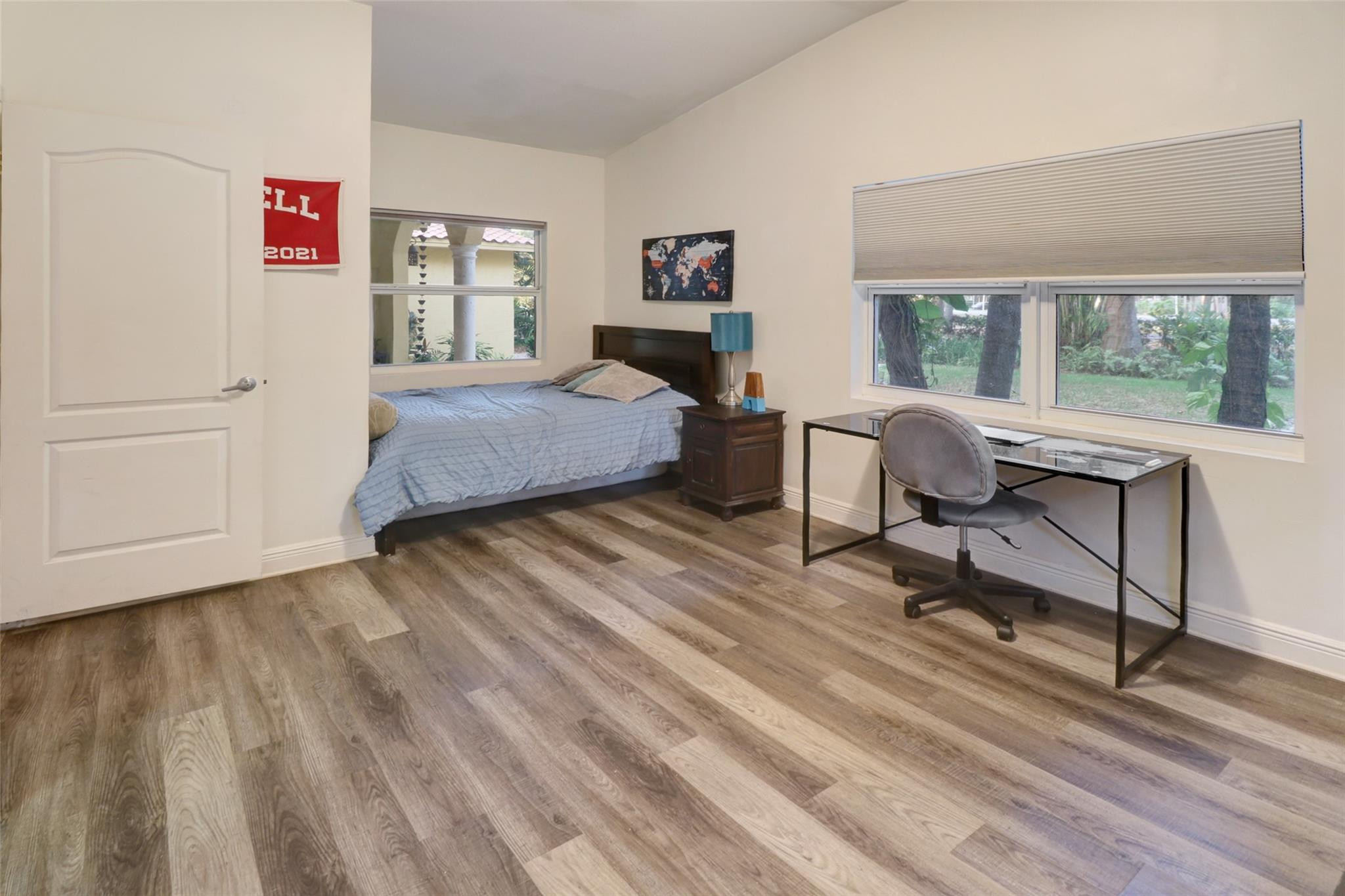 11410 Griffing Boulevard Miami, FL 33161 - Photo 18 of 42 a bedroom with a bed and a view of balcony