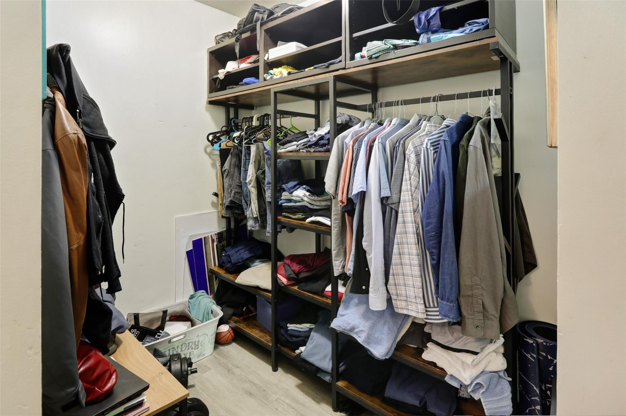 11410 Griffing Boulevard Miami, FL 33161 - Photo 19 of 42 a view of walk in closet with clothes and shoes