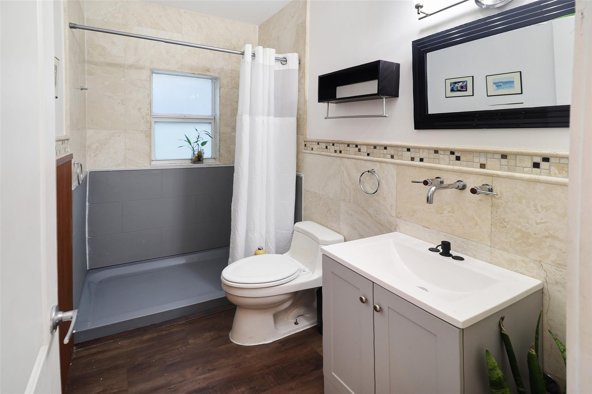 11410 Griffing Boulevard Miami, FL 33161 - Photo 20 of 42 a bathroom with a sink toilet and shower