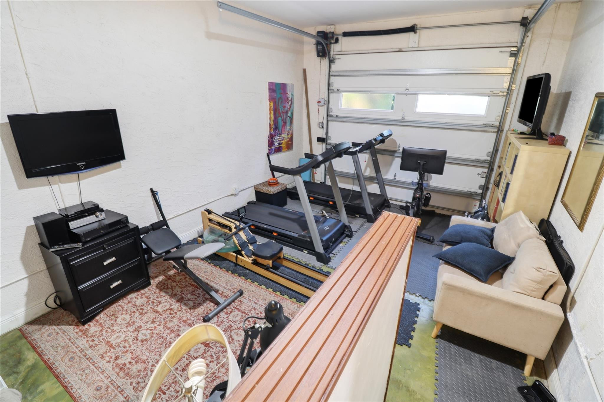 11410 Griffing Boulevard Miami, FL 33161 - Photo 22 of 42 a living room with furniture and a flat screen tv