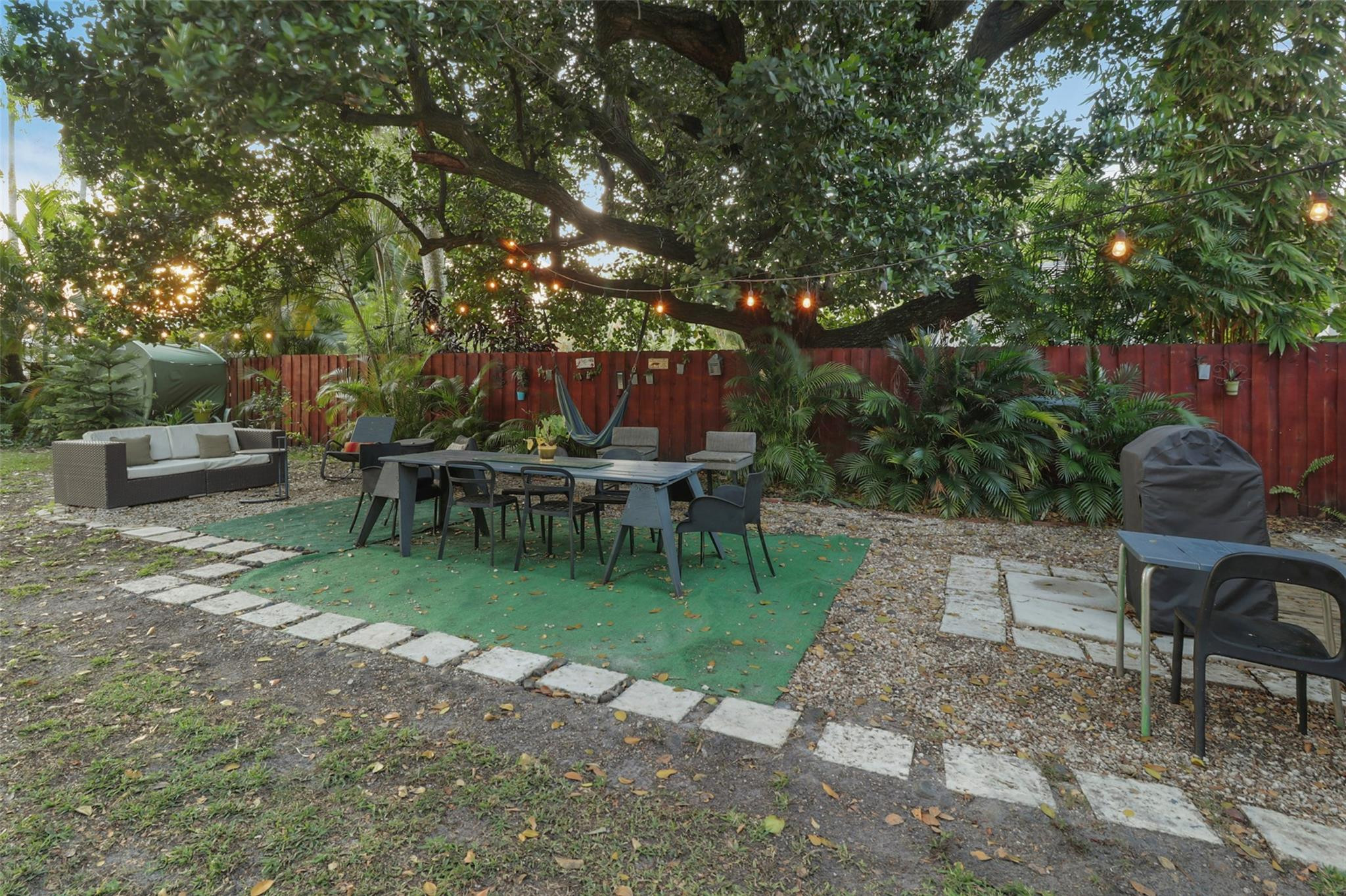 11410 Griffing Boulevard Miami, FL 33161 - Photo 27 of 42 a view of a chair and table in backyard