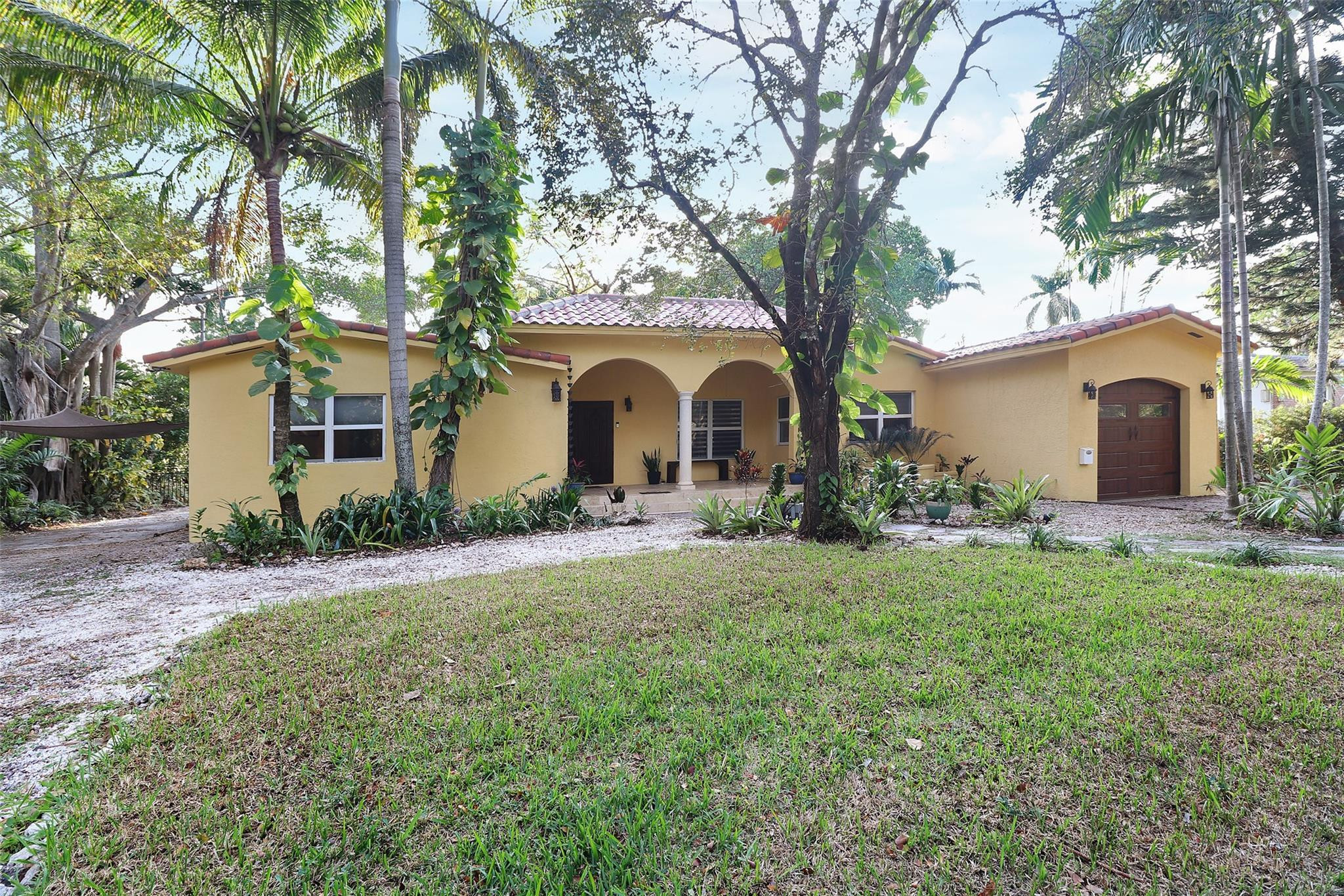 11410 Griffing Boulevard Miami, FL 33161 - Photo 30 of 42 a front view of a house with garden