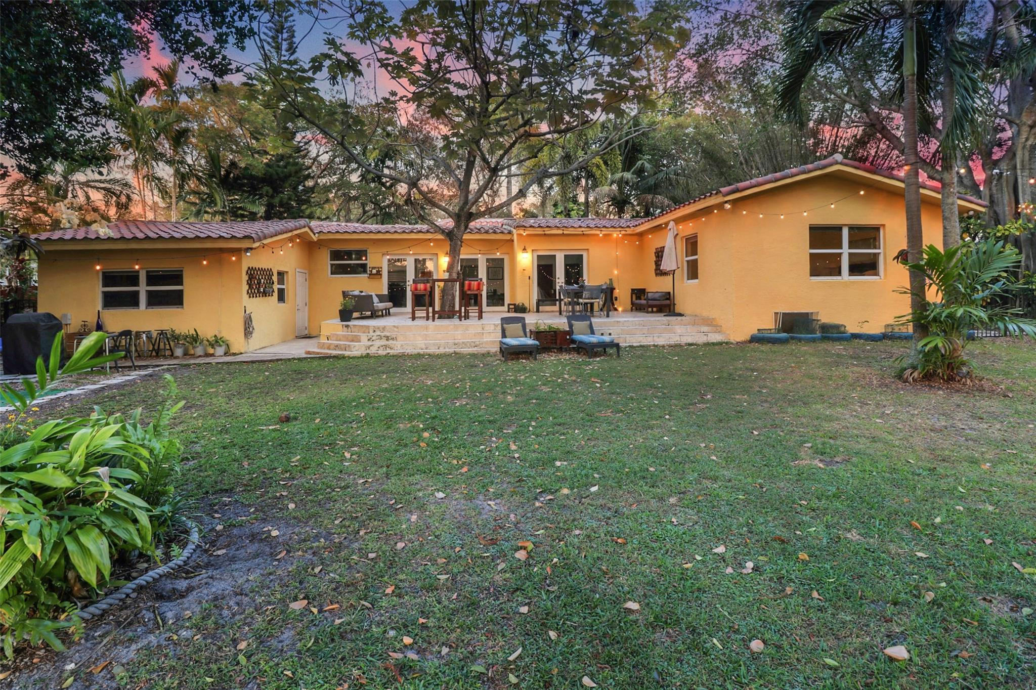 11410 Griffing Boulevard Miami, FL 33161 - Photo 41 of 42 a view of a house with a yard