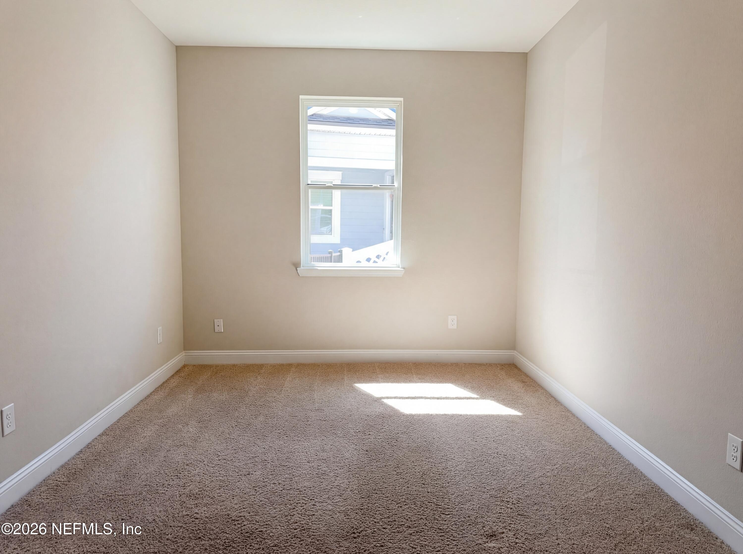 56 Thistleton Way Street St. Augustine, FL 32092 - Photo 11 of 28 an empty room with a window