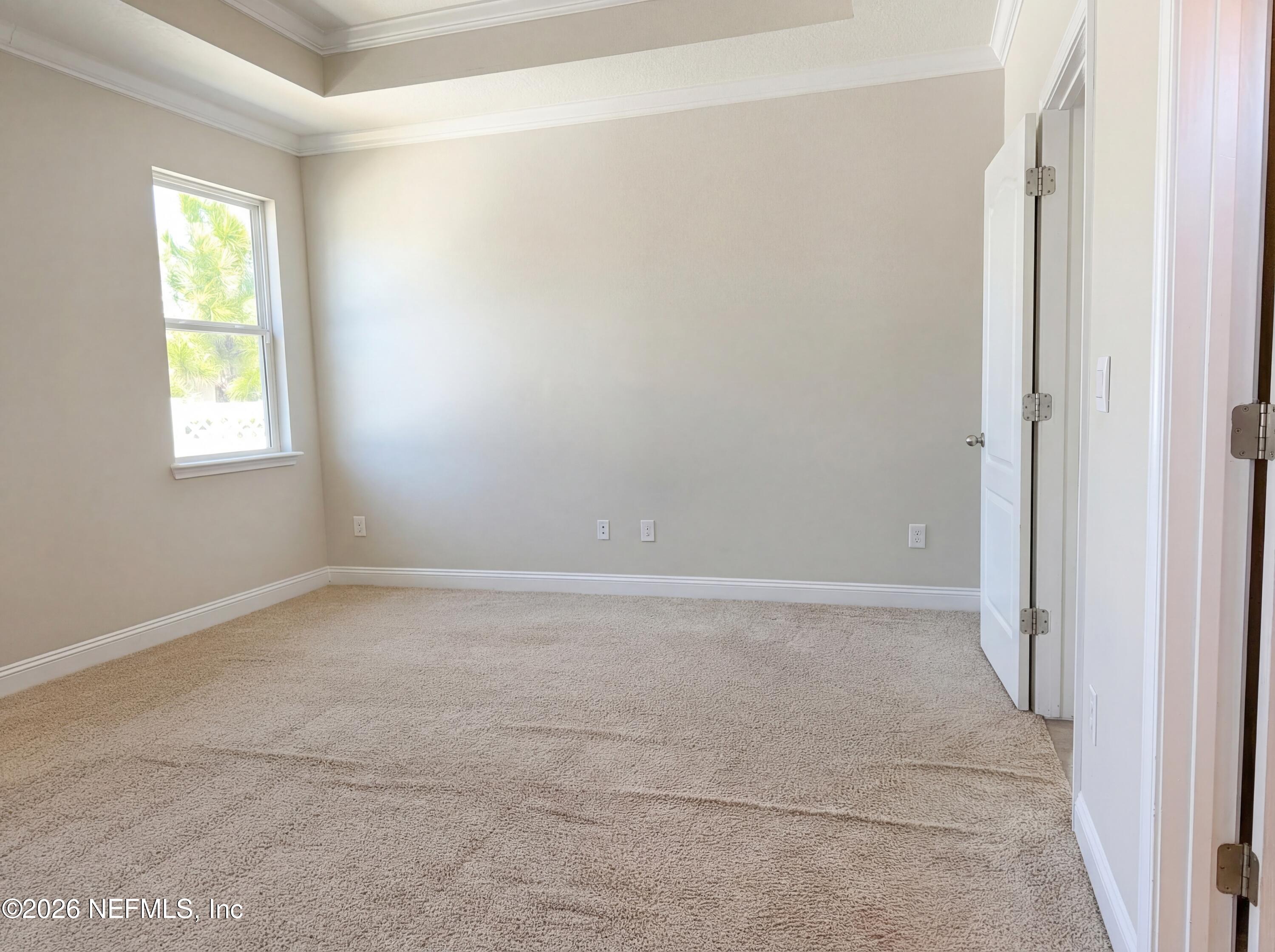 56 Thistleton Way Street St. Augustine, FL 32092 - Photo 17 of 28 an empty room with a window