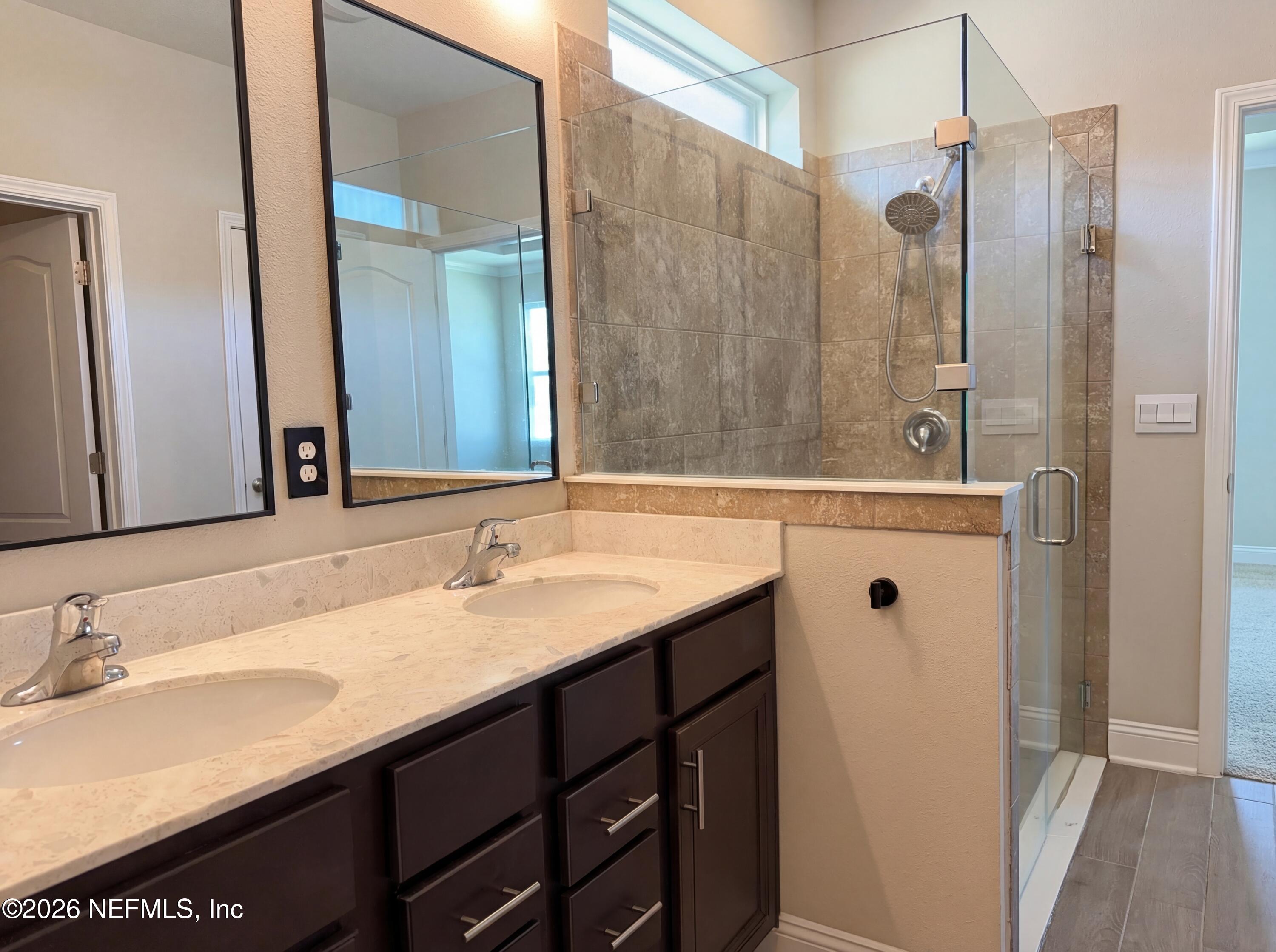56 Thistleton Way Street St. Augustine, FL 32092 - Photo 19 of 28 a bathroom with a sink and a mirror