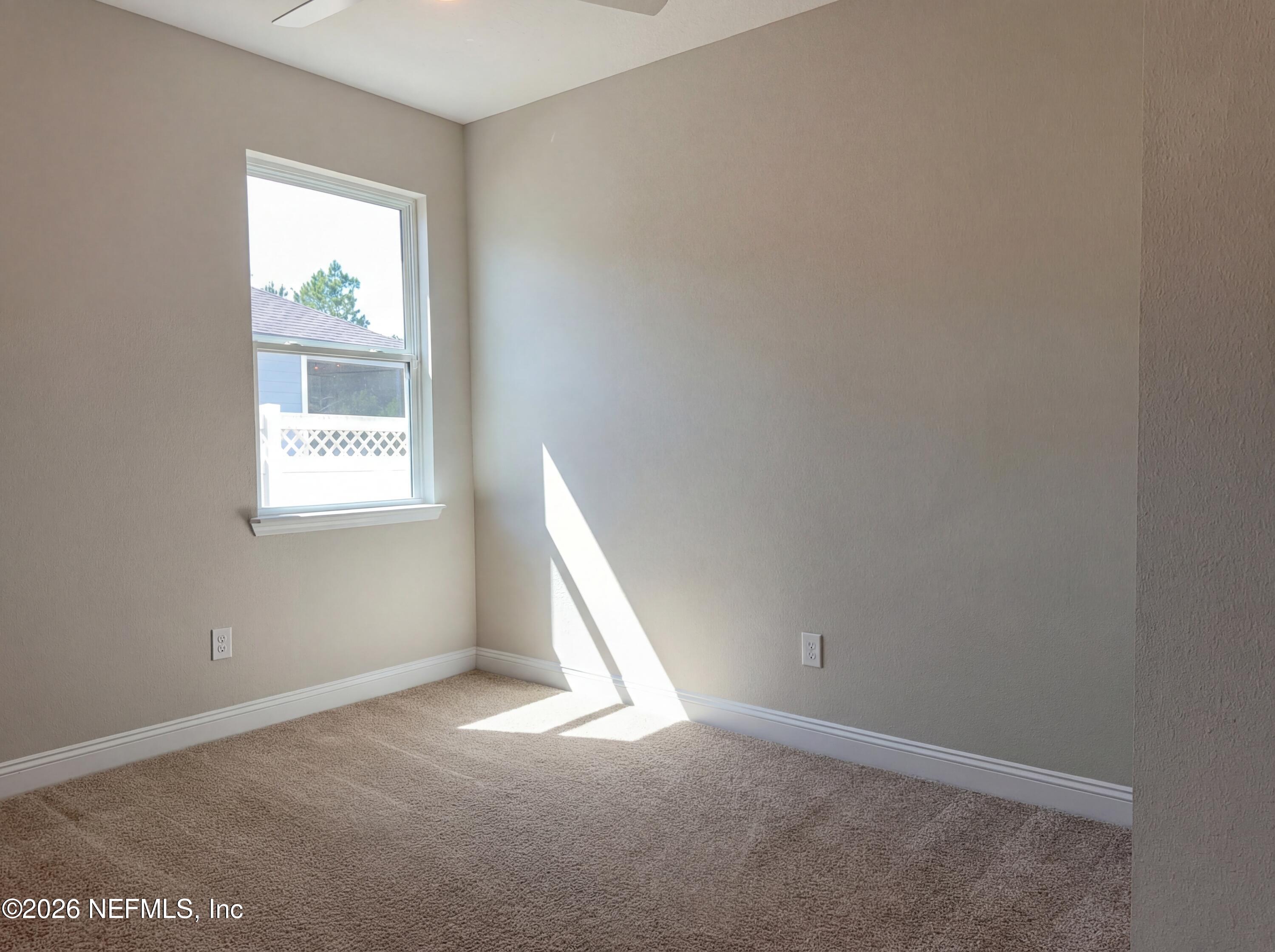 56 Thistleton Way Street St. Augustine, FL 32092 - Photo 23 of 28 an empty room with windows
