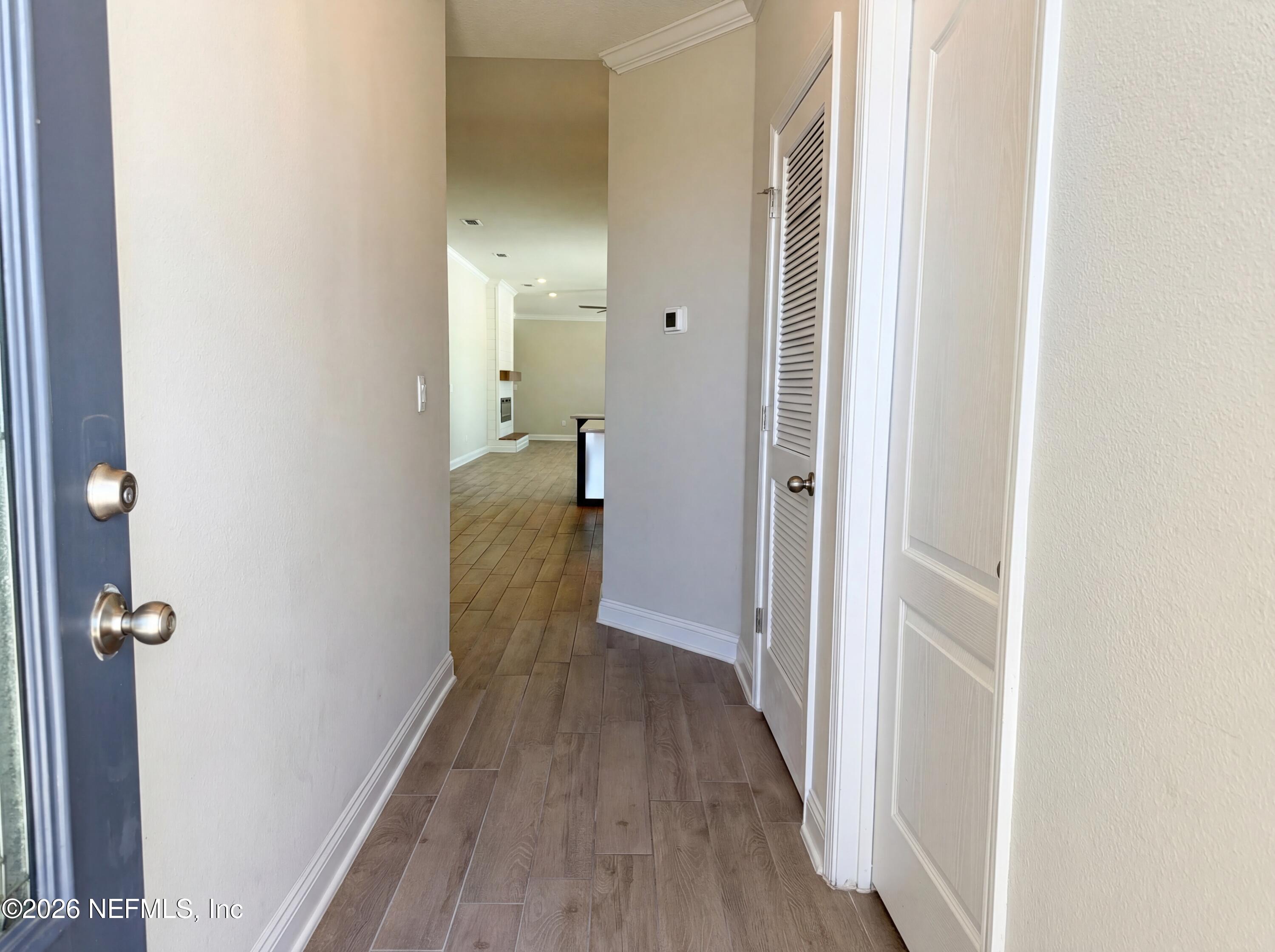 56 Thistleton Way Street St. Augustine, FL 32092 - Photo 8 of 28 a view of a hallway with wooden floor