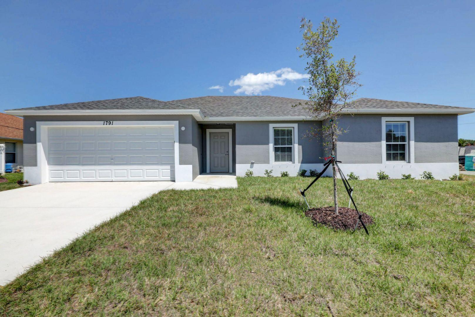 537 Southwest Aster Road Port St. Lucie, FL 34953 - Photo 1 of 55 EXTERIOR FRONT