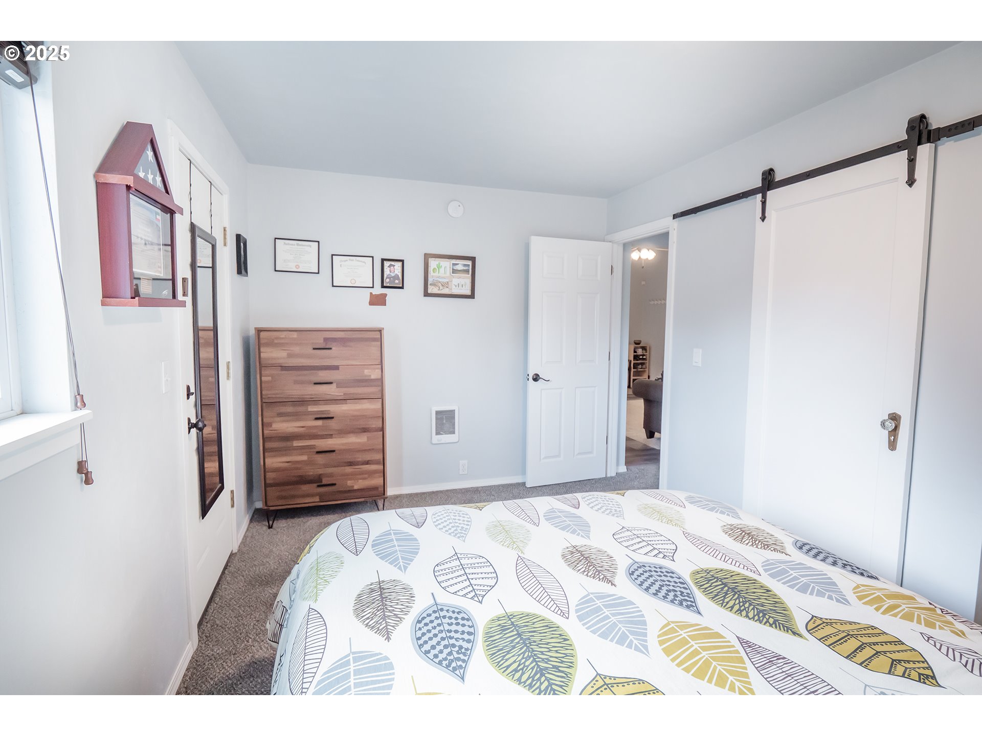 2111 South Bertelsen Road Eugene, OR 97405 - Photo 11 of 32 a bedroom with a bed and a mirror