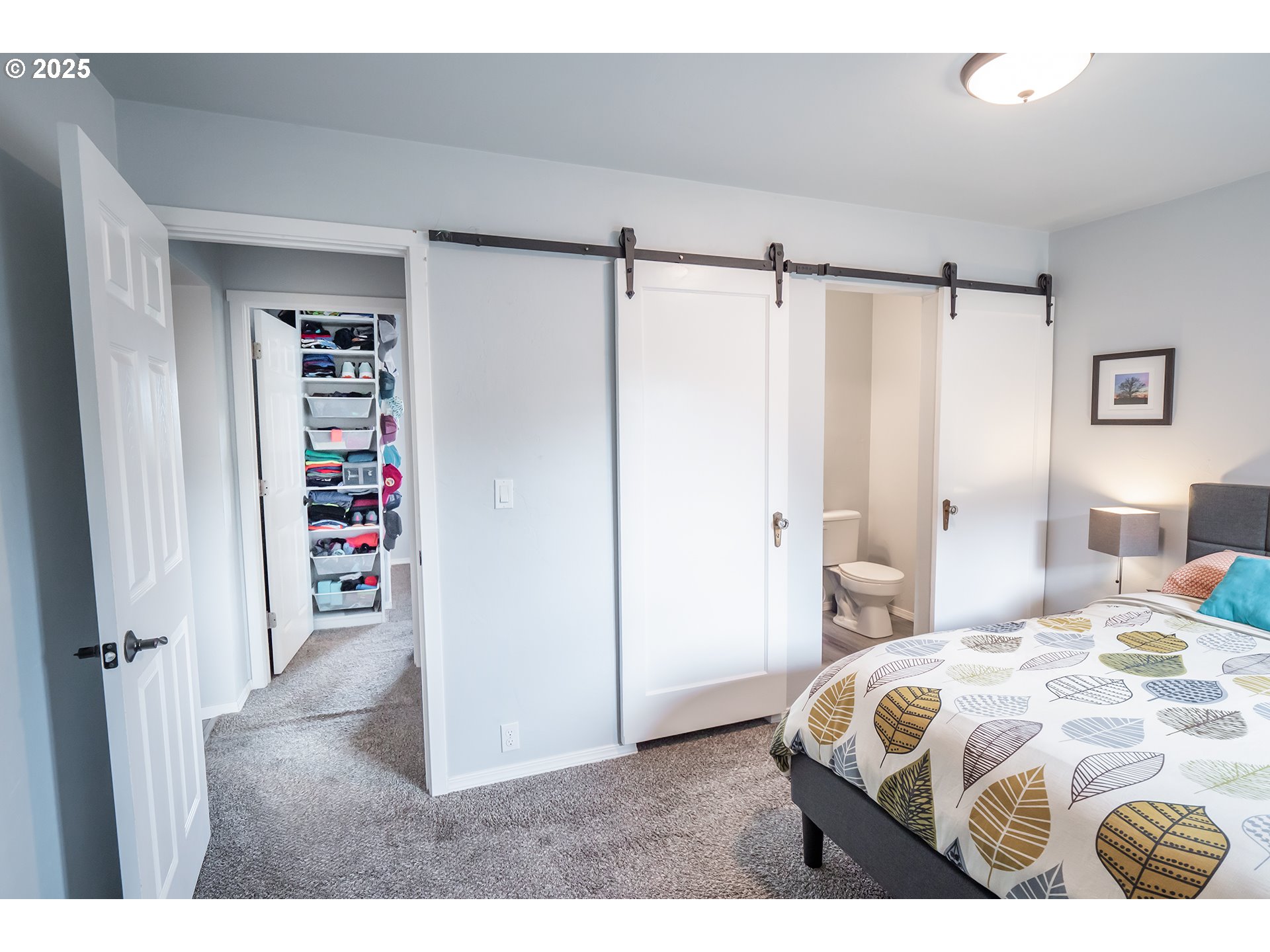 2111 South Bertelsen Road Eugene, OR 97405 - Photo 12 of 32 a bedroom with a bed and a cabinets