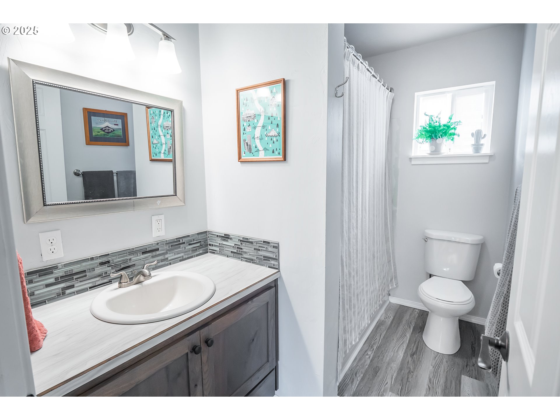 2111 South Bertelsen Road Eugene, OR 97405 - Photo 18 of 32 a bathroom with a sink and a toilet