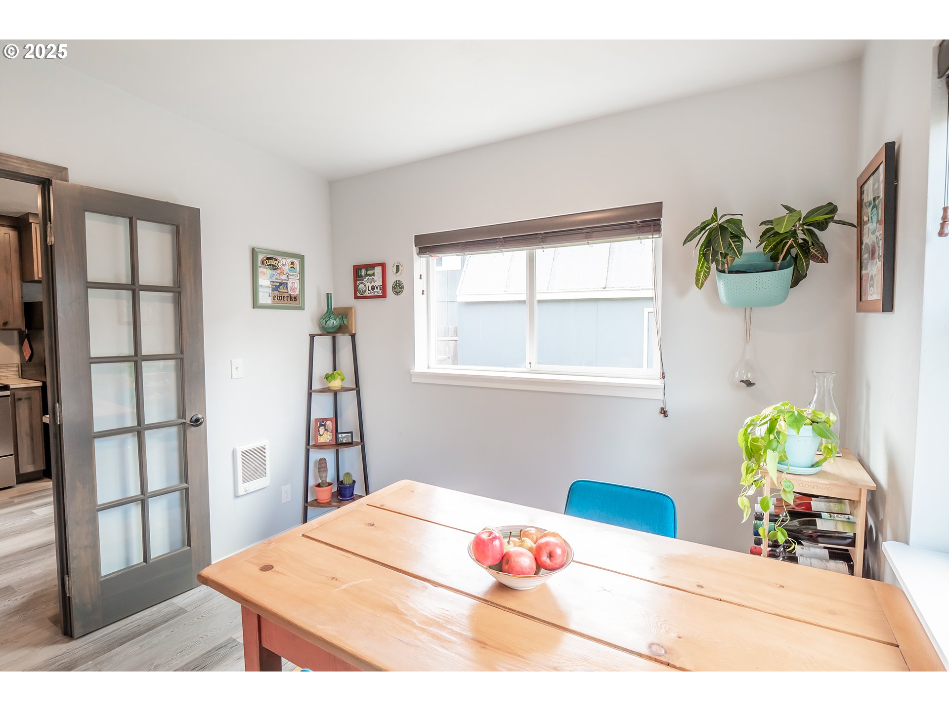 2111 South Bertelsen Road Eugene, OR 97405 - Photo 20 of 32 a bedroom with a bed a bookshelf and a window