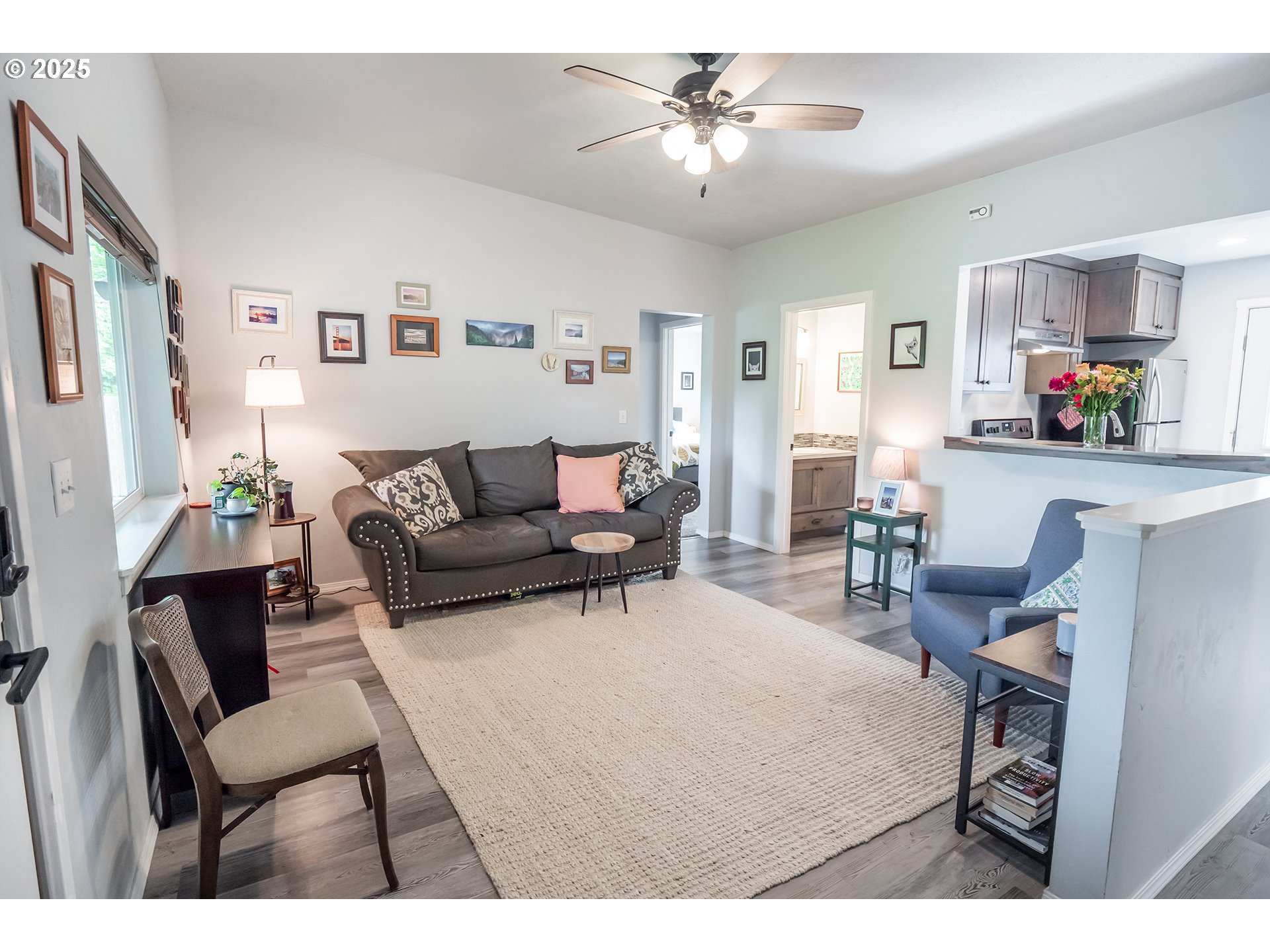 2111 South Bertelsen Road Eugene, OR 97405 - Photo 2 of 32 a living room with furniture and a chandelier