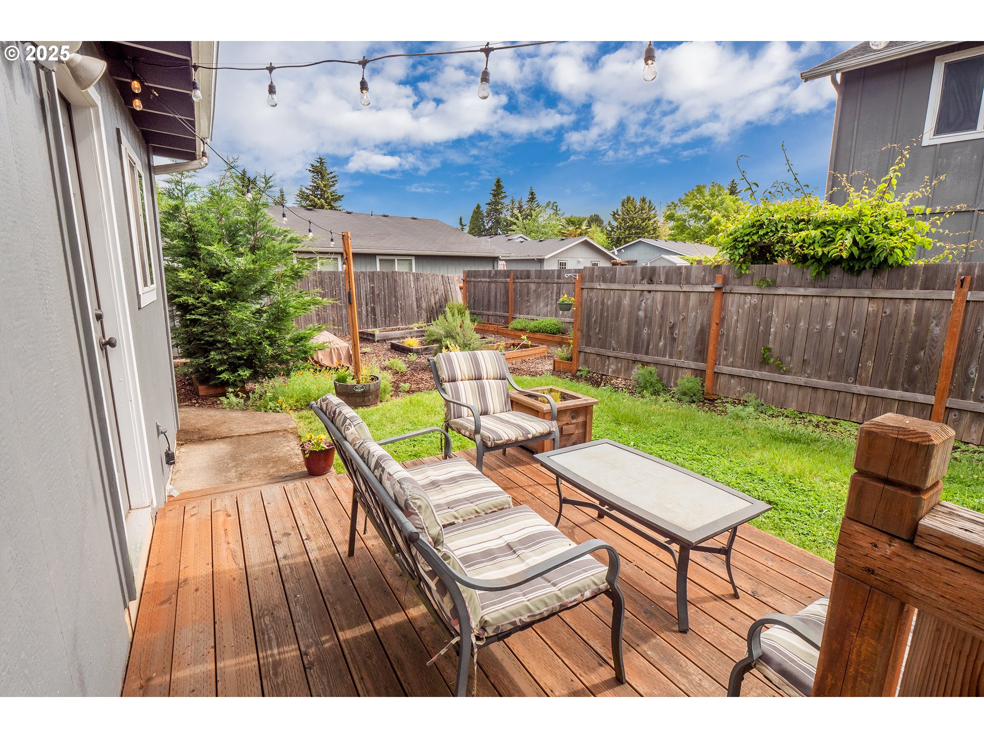 2111 South Bertelsen Road Eugene, OR 97405 - Photo 23 of 32 a view of a chairs and table in backyard of the house