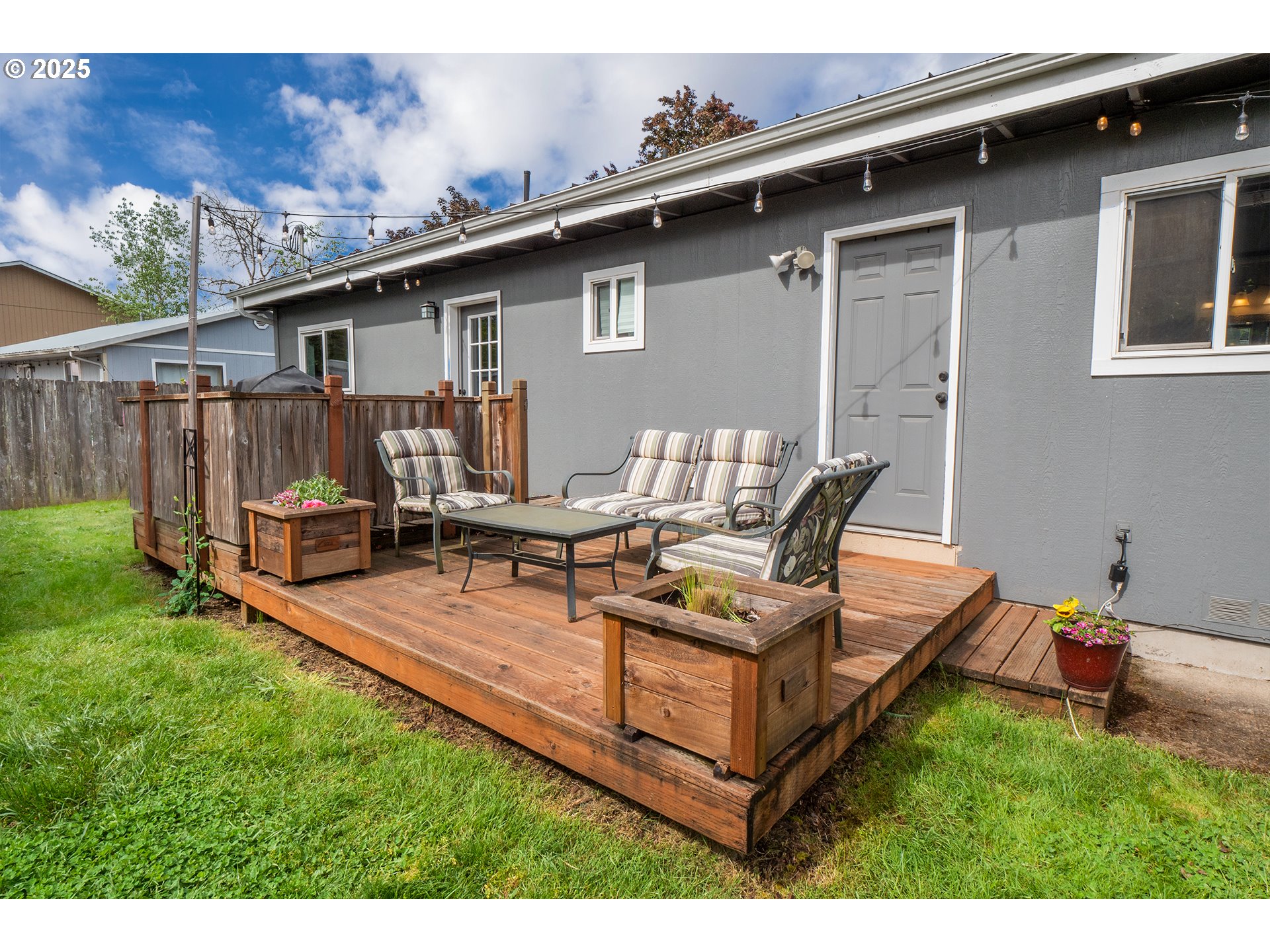 2111 South Bertelsen Road Eugene, OR 97405 - Photo 26 of 32 a view of a backyard with table and chairs